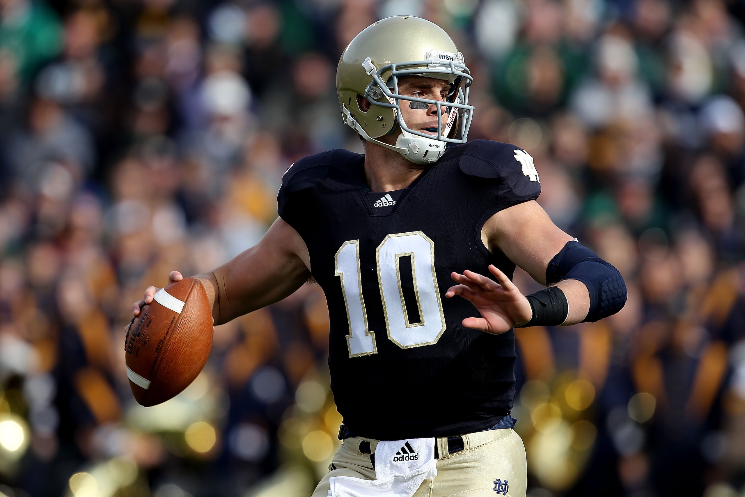 SOUTH BEND, IN - OCTOBER 30: Dayne Crist #10 of the Notre Dame Fighting Irish looks for a receiver against the Tulsa Golden Hurricane at Notre Dame Stadium on October 30, 2010 in South Bend, Indiana. Tulsa defeated Notre Dame 28-27. (Photo by Jonathan Dan