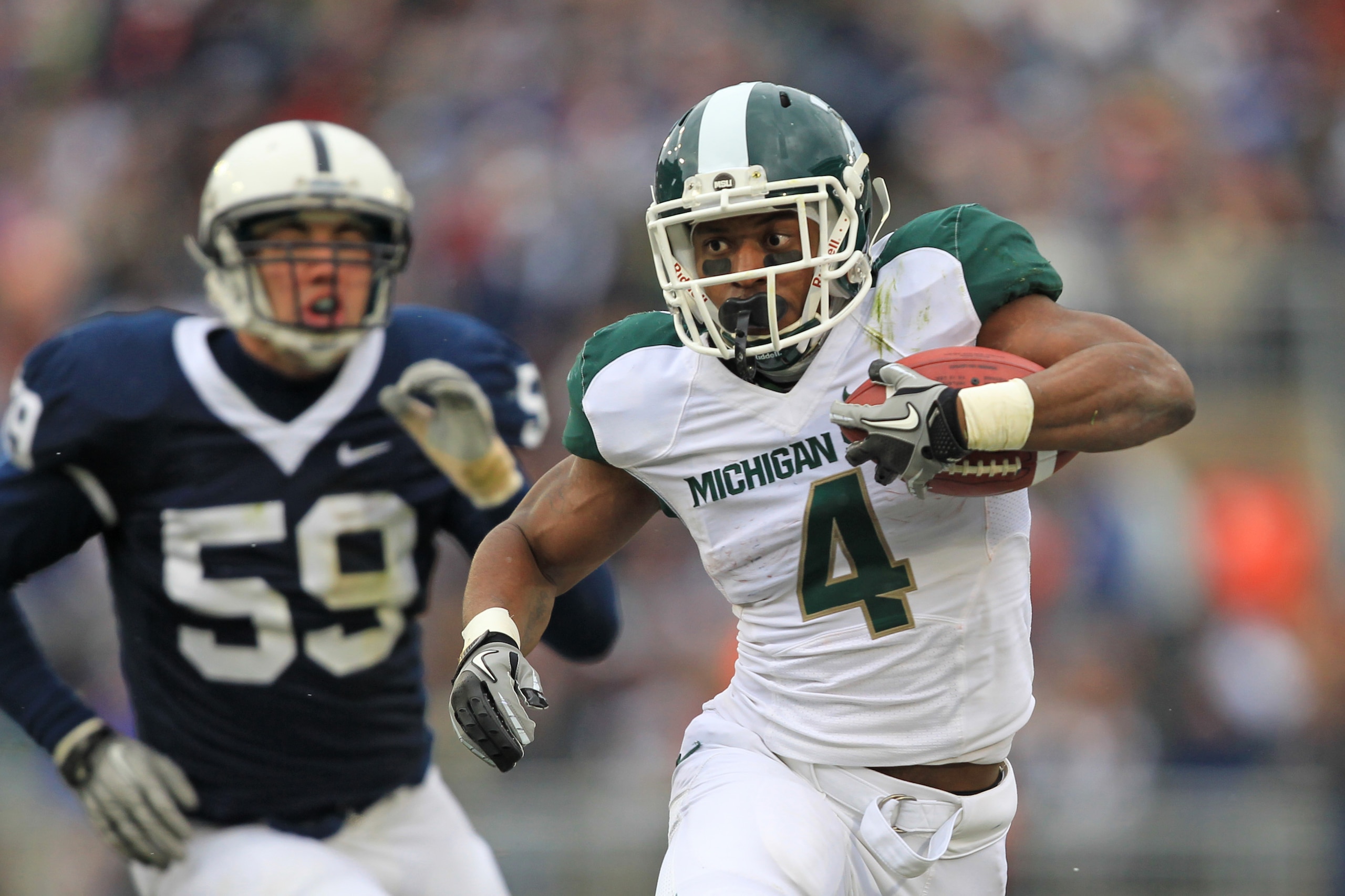 STATE COLLEGE, PA - NOVEMBER 27: Running back Edwin Baker #4 of the Michigan State Spartans carries the ball during a game against the Penn State Nittany Lions on November 27, 2010 at Beaver Stadium in State College, Pennsylvania. (Photo by Hunter Martin/