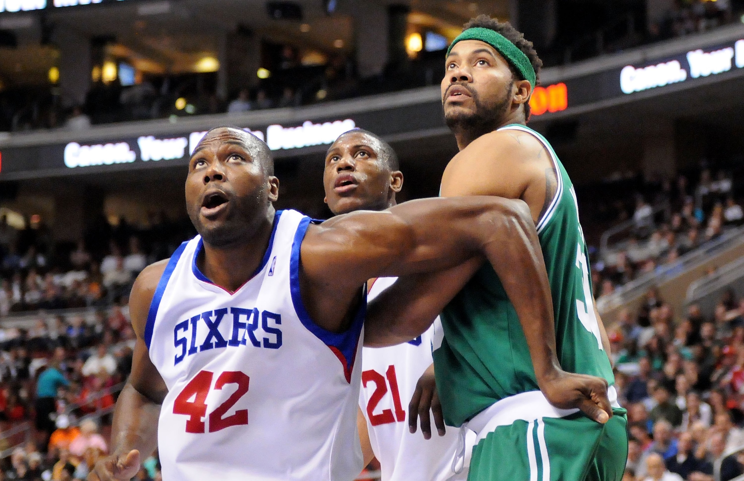PHILADELPHIA - NOVEMBER 03:  Elton Brand #42 and Thaddeus Young #21 of the Philadelphia 76ers box out against Rasheed Wallace of the Boston Celtics at the Wachovia Center on November 3, 2009 in Philadelphia, Pennsylvania.  NOTE TO USER: User expressly ack