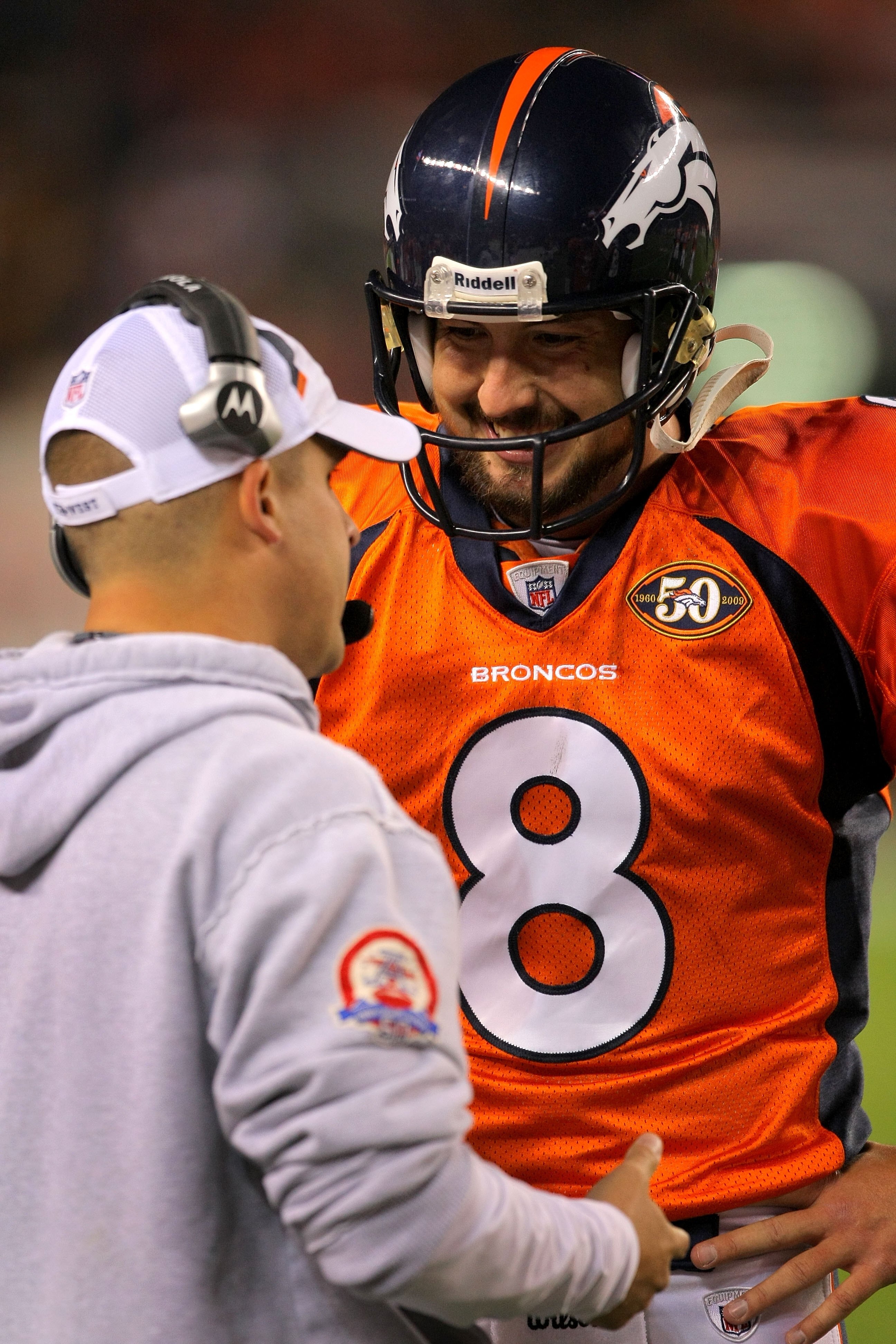 DENVER - NOVEMBER 09:  Head coach Josh McDaniels talks with quarterback Kyle Orton #8 of the Denver Broncos as they face the Pittsburgh Steelers on during NFL action at Invesco Field at Mile High on November 9, 2009 in Denver, Colorado. The Steelers defea