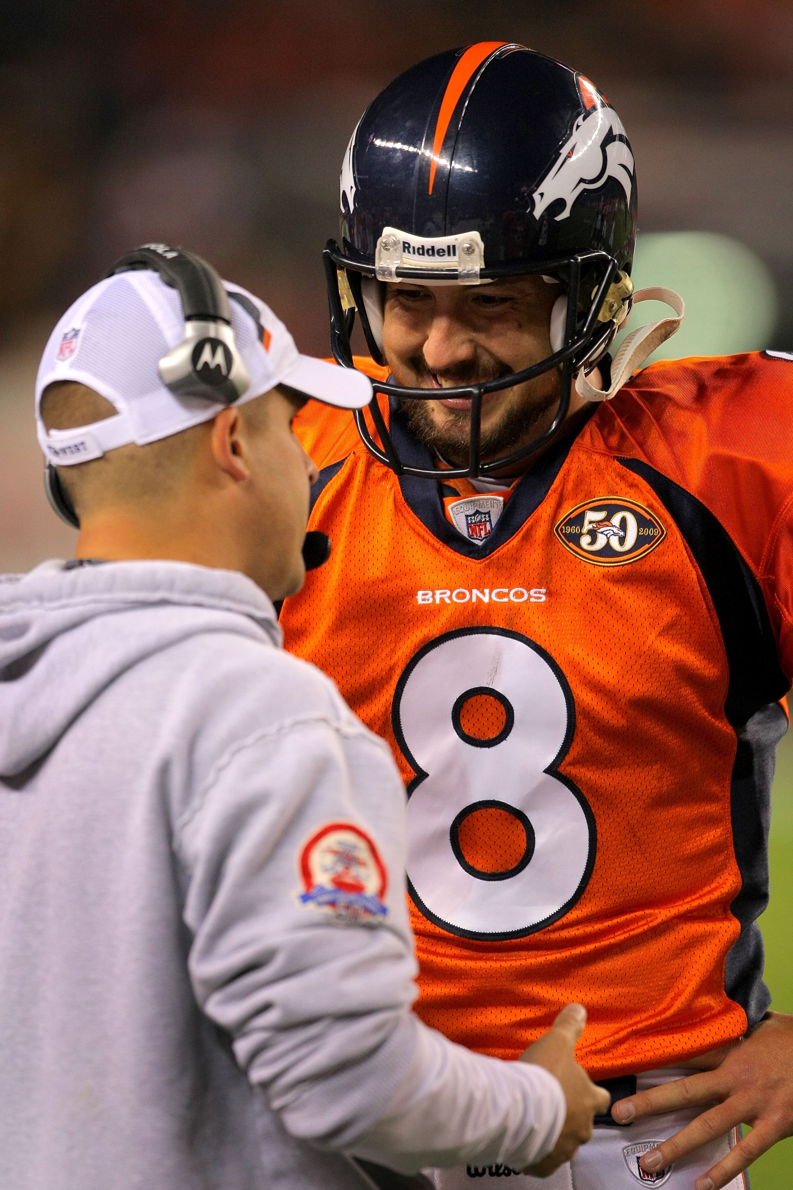 DENVER - NOVEMBER 09:  Head coach Josh McDaniels talks with quarterback Kyle Orton #8 of the Denver Broncos as they face the Pittsburgh Steelers on during NFL action at Invesco Field at Mile High on November 9, 2009 in Denver, Colorado. The Steelers defea