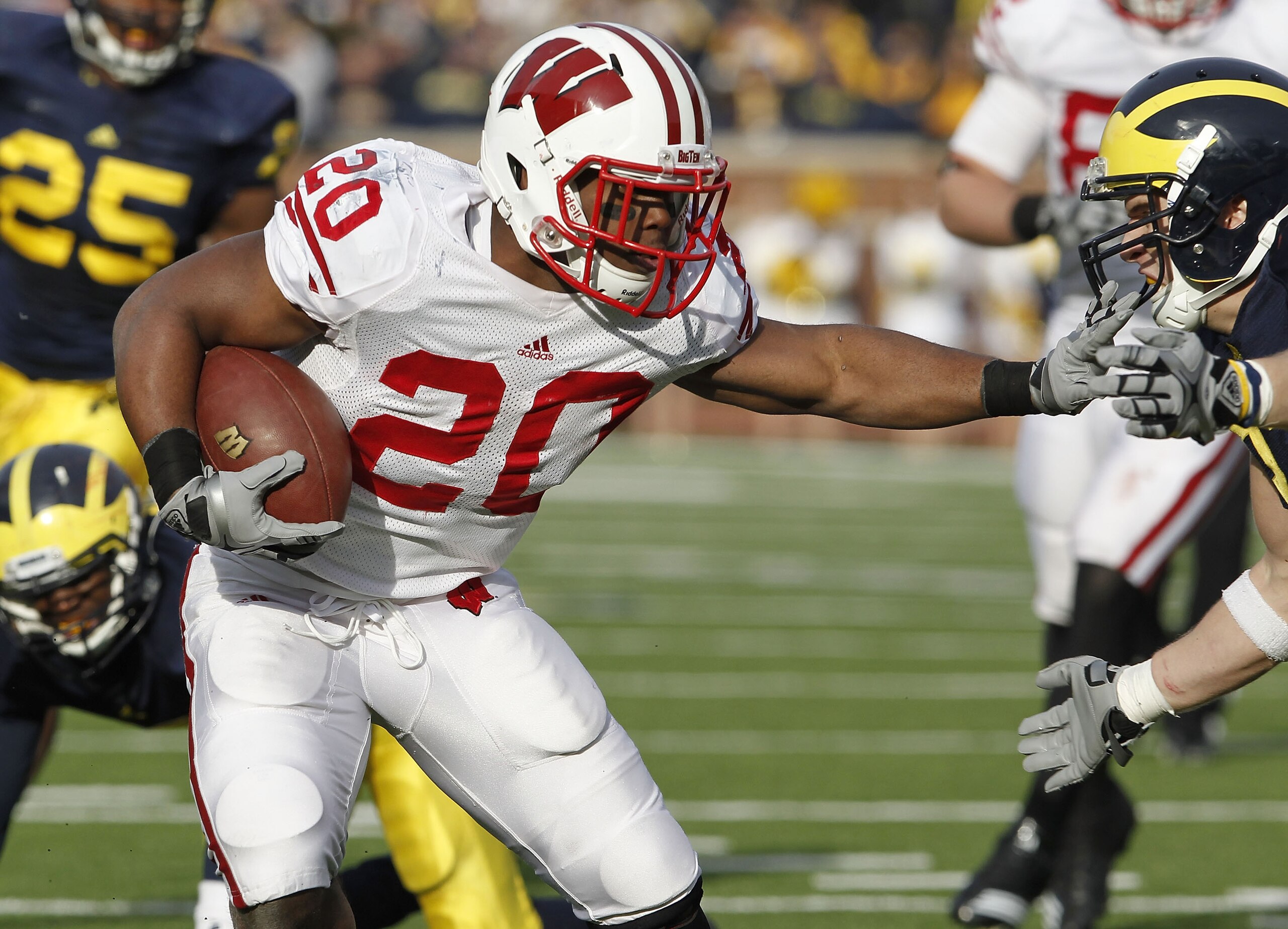 ANN ARBOR, MI - NOVEMBER 20:  James White #20 of the Wisconsin Badgers looks for running room while playing the Michigan Wolverines at Michigan Stadium on November 20, 2010 in Ann Arbor, Michigan. Wisconson won the game 48-28.  (Photo by Gregory Shamus/Ge