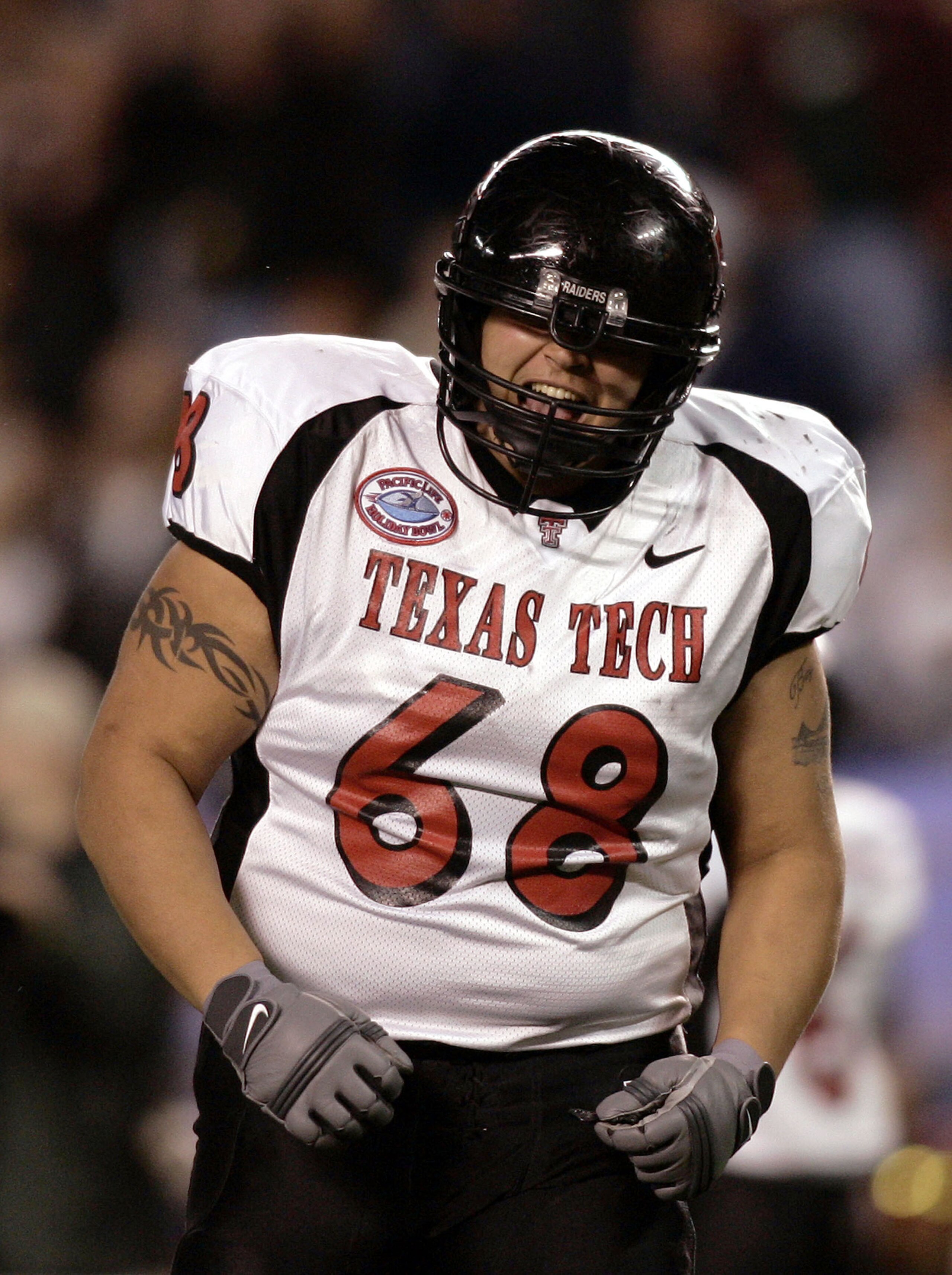 SAN DIEGO, CA - DECEMBER 30:  Offensive lineman Daniel Christian #68 of the Texas Tech Red Raiders celebrates a touchdown for his team against the California Golden Bears during the first half of the Pacific Life Holiday Bowl at Qualcomm Stadium on Decemb