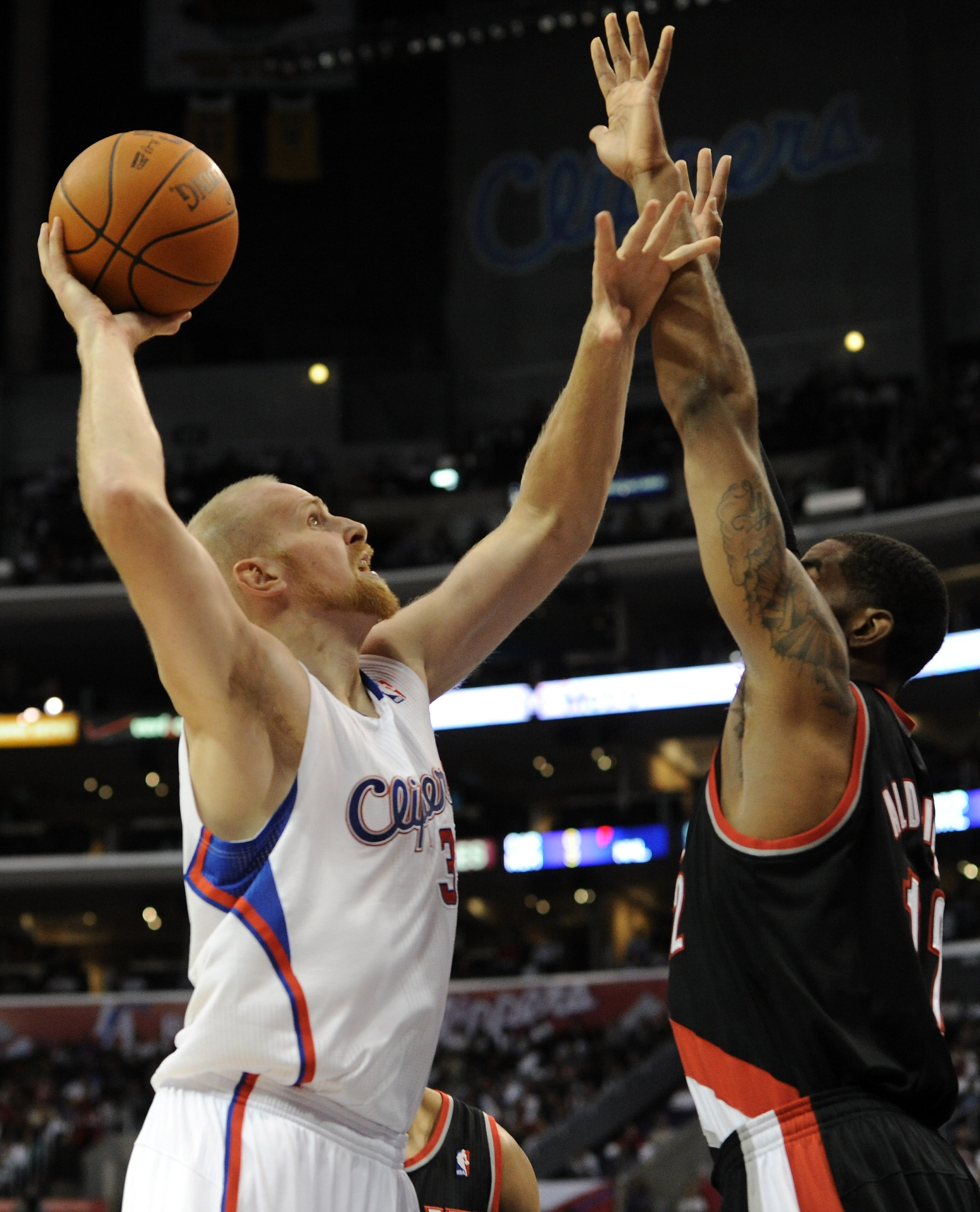 LOS ANGELES, CA - OCTOBER 27:  Chris Kaman #35 of the Los Angeles Clippers shoots a jump hook over LaMarcus Aldridge #12 of the Portland Trail Blazers at Staples Center on October 27, 2010 in Los Angeles, California. NOTE TO USER: User expressly acknowled