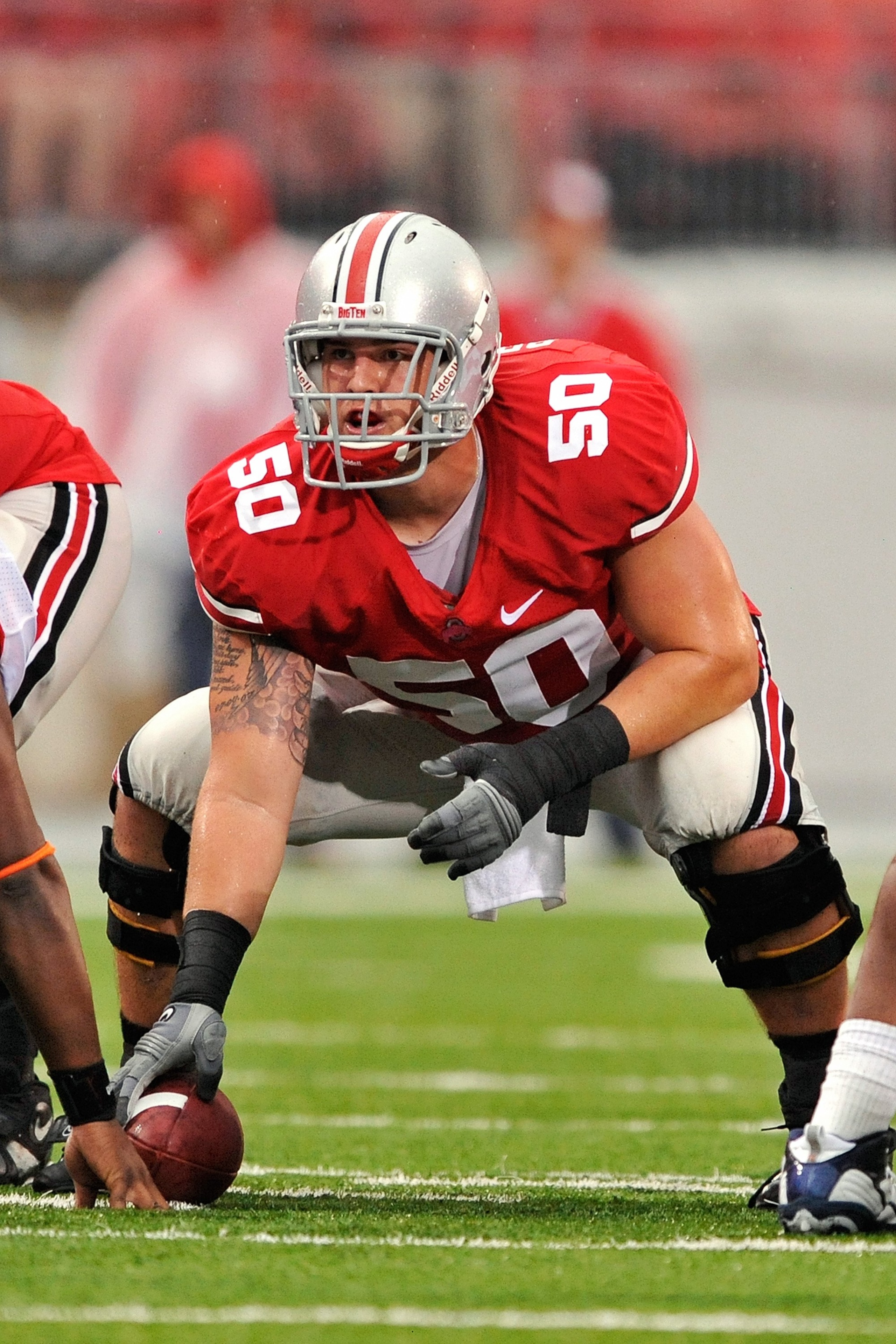 COLUMBUS, OH - SEPTEMBER 26:  Offensive lineman Mike Brewster #50 of the Ohio State Buckeyes prepares the snap the ball against the Illinois Fighting Illini at Ohio Stadium on September 26, 2009 in Columbus, Ohio.  (Photo by Jamie Sabau/Getty Images)