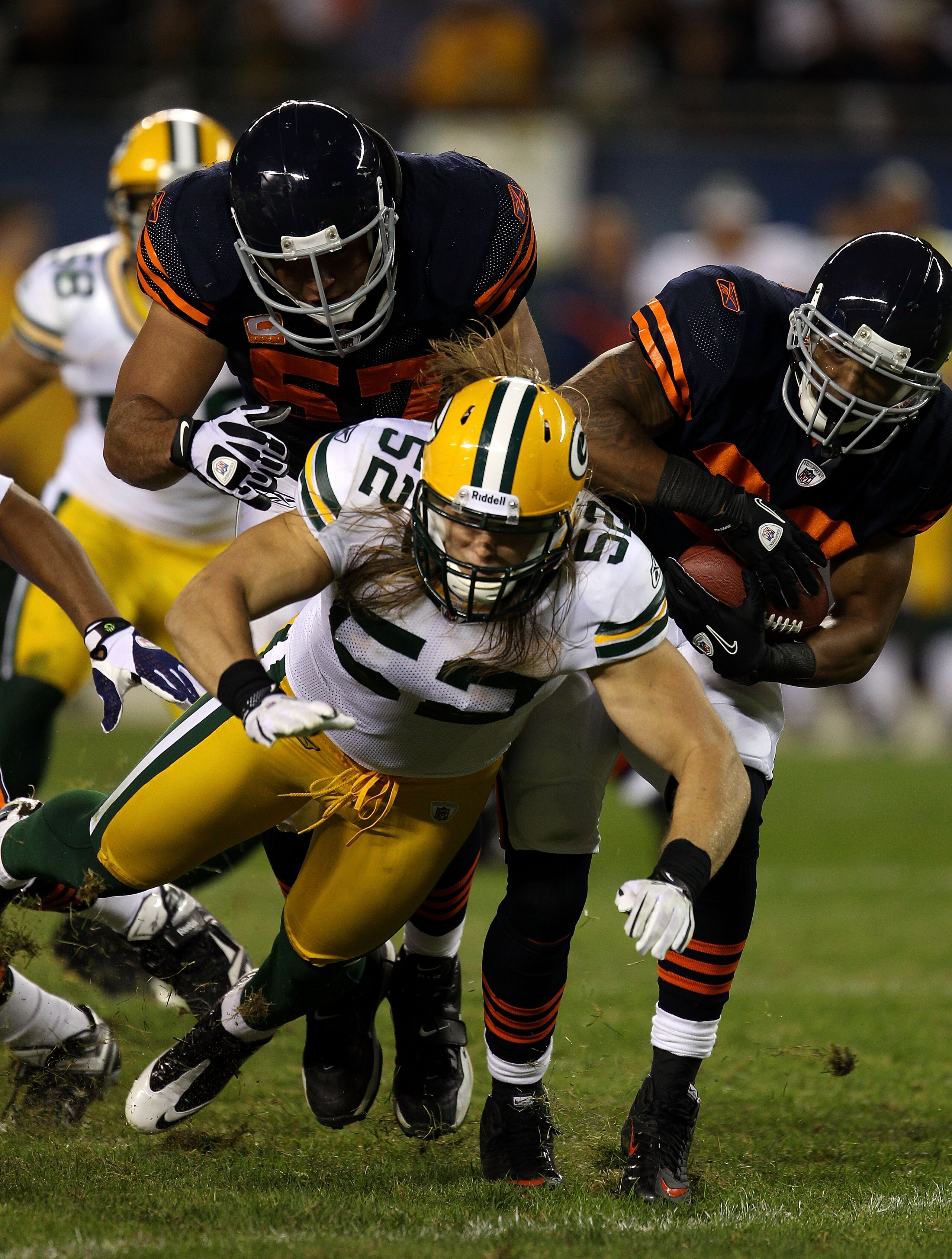 CHICAGO - SEPTEMBER 27: Matt Forte #22 (R) of the Chicago Bears runs the ball behind the block of center Olin Kreutz #57 (L) against Clay Matthews #52 of the Green Bay Packers at Soldier Field on September 27, 2010 in Chicago, Illinois. The Bears won 20- CHICAGO - SEPTEMBER 27: Matt Forte #22 (R) of the Chicago Bears runs the ball behind the block of center Olin Kreutz #57 (L) against Clay Matthews #52 of the Green Bay Packers at Soldier Field on September 27, 2010 in Chicago, Illinois. The Bears won 20-