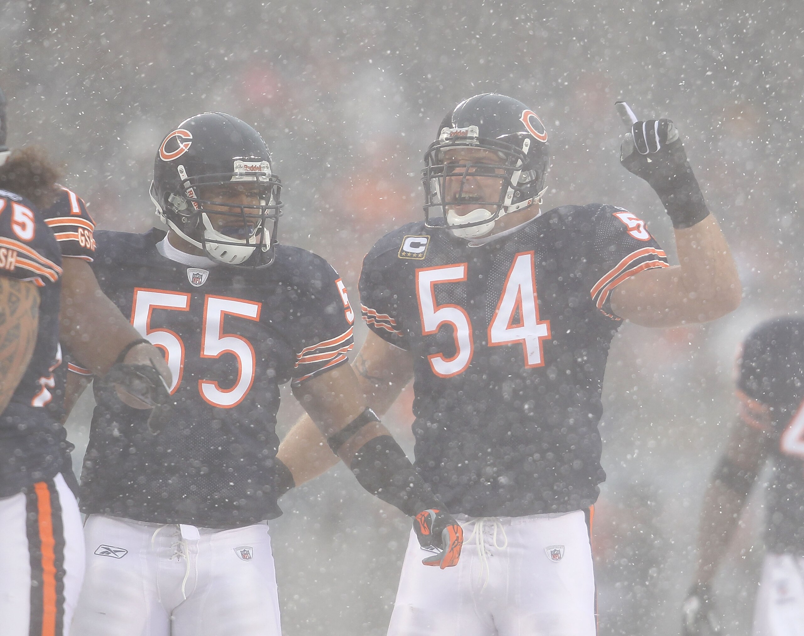 CHICAGO, IL - DECEMBER 12: Brian Urlacher #54 of the Chicago Bears calls a defensive play as teammate Lance Briggs #55 moves into position against the New England Patriots at Soldier Field on December 12, 2010 in Chicago, Illinois. The Patriots defeated t CHICAGO, IL - DECEMBER 12: Brian Urlacher #54 of the Chicago Bears calls a defensive play as teammate Lance Briggs #55 moves into position against the New England Patriots at Soldier Field on December 12, 2010 in Chicago, Illinois. The Patriots defeated t