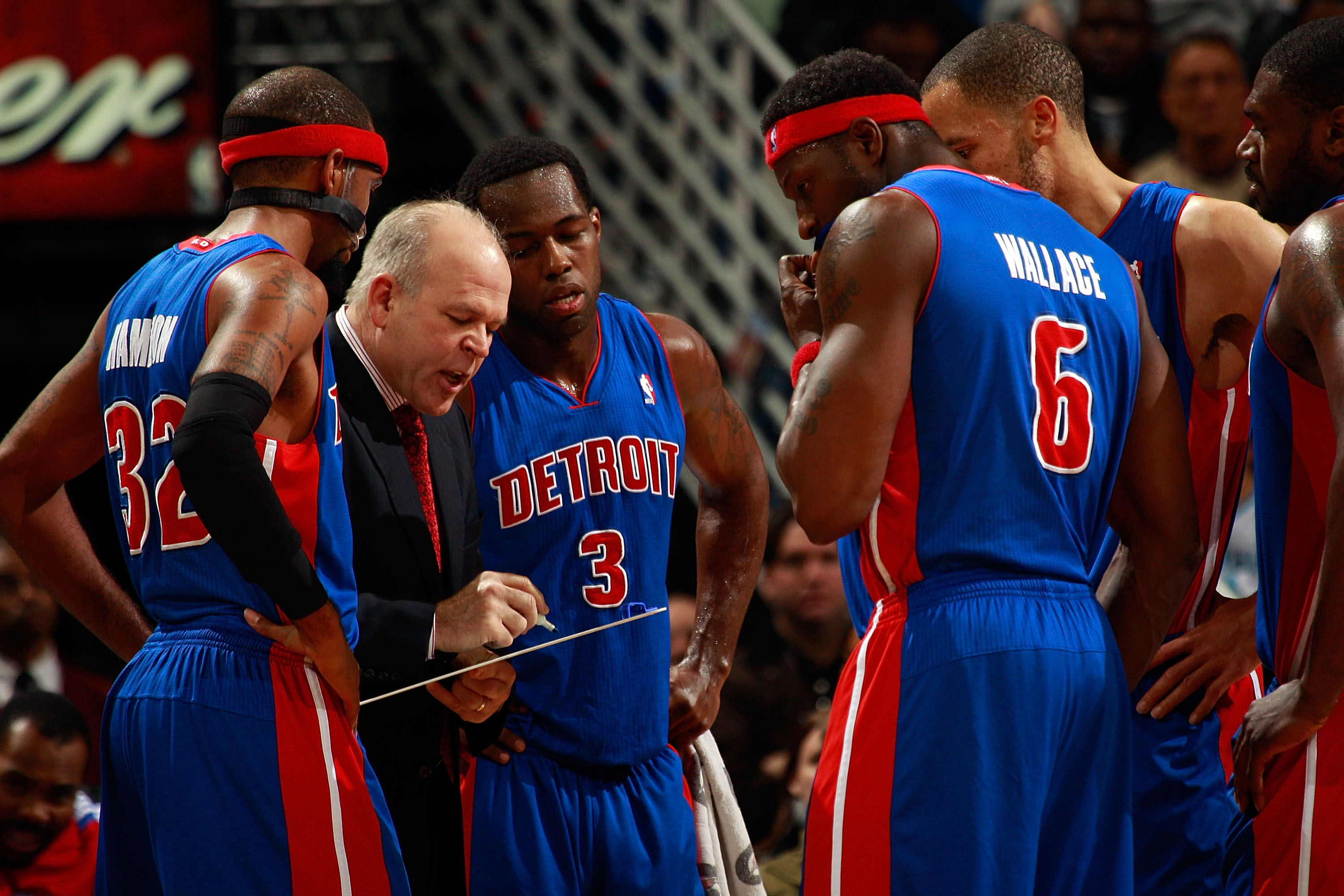 The Detroit Pistons team poses for a picture after their win over