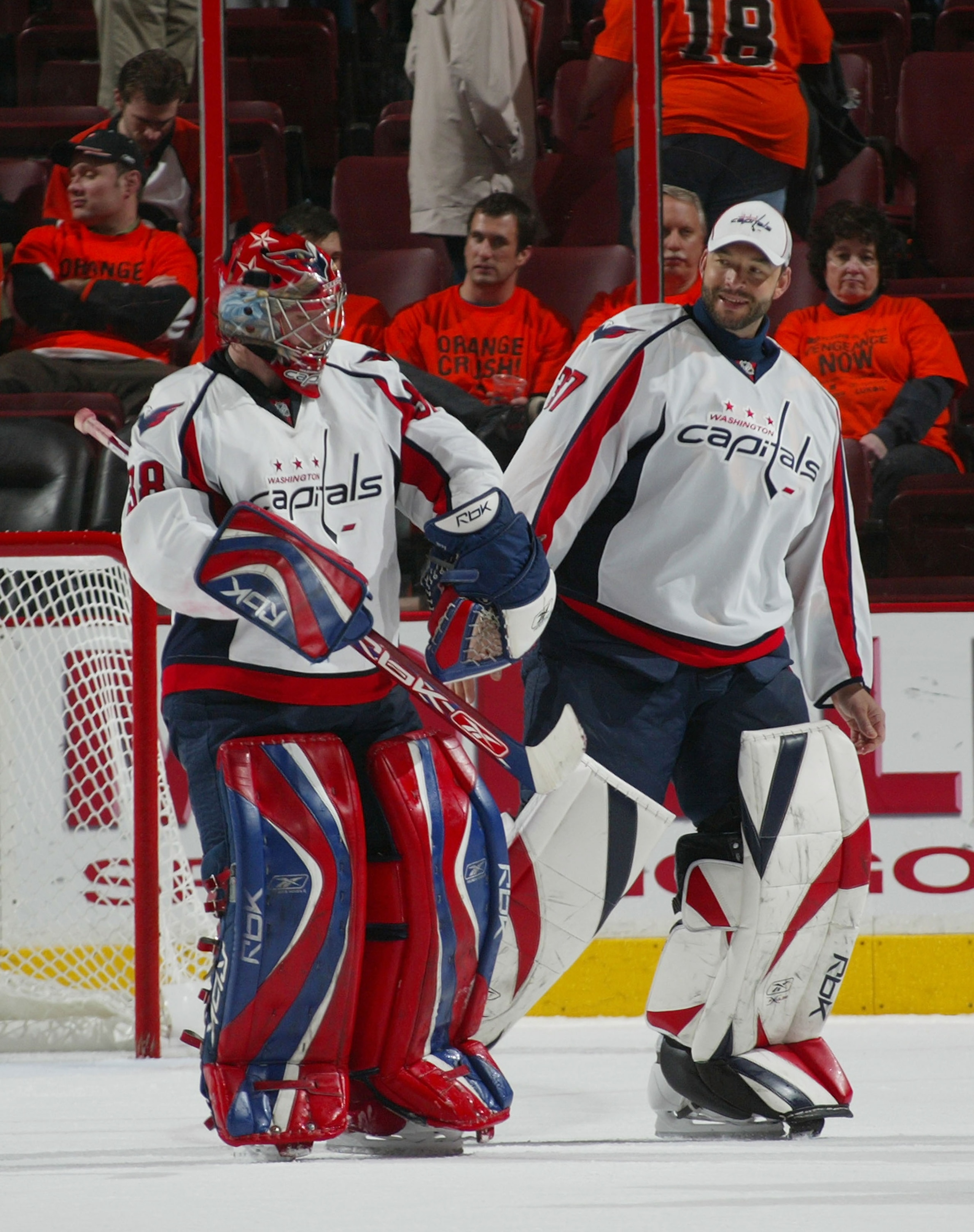 PHILADELPHIA - APRIL 21: Goaltenders Cristobal Huet #38  and Olie Kolzig #37 of the Washington Capitals head off the ice after defeating the Philadelphia Flyers in game six of the Eastern Conference Quarterfinals of the 2008 NHL Stanley Cup Playoffs on Ap
