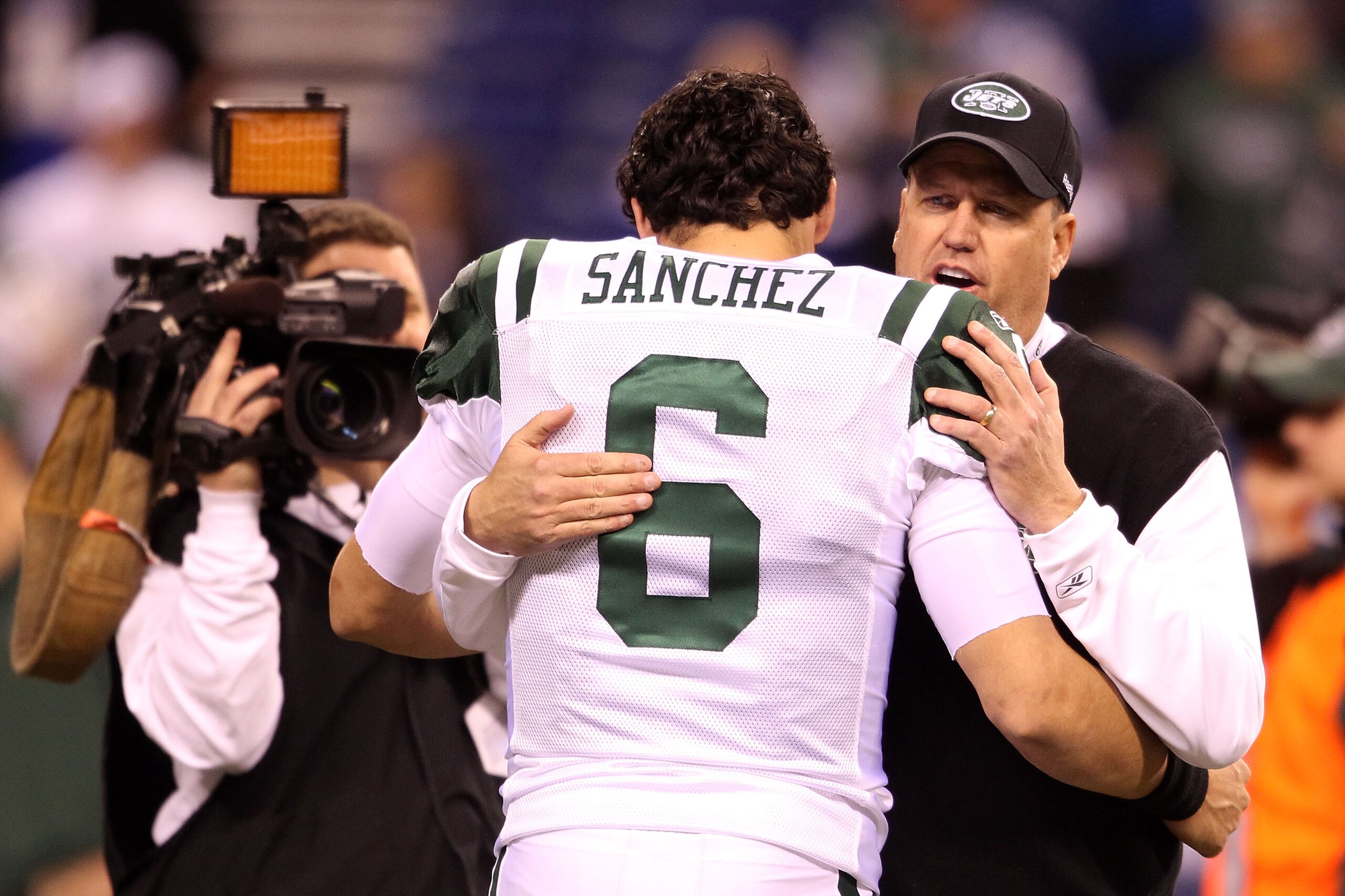INDIANAPOLIS, IN - JANUARY 08:  Head coach Rex Ryan and Mark Sanchez #6 of the New York Jets talk on the field during warm ups against the Indianapolis Colts during their 2011 AFC wild card playoff game at Lucas Oil Stadium on January 8, 2011 in Indianapo