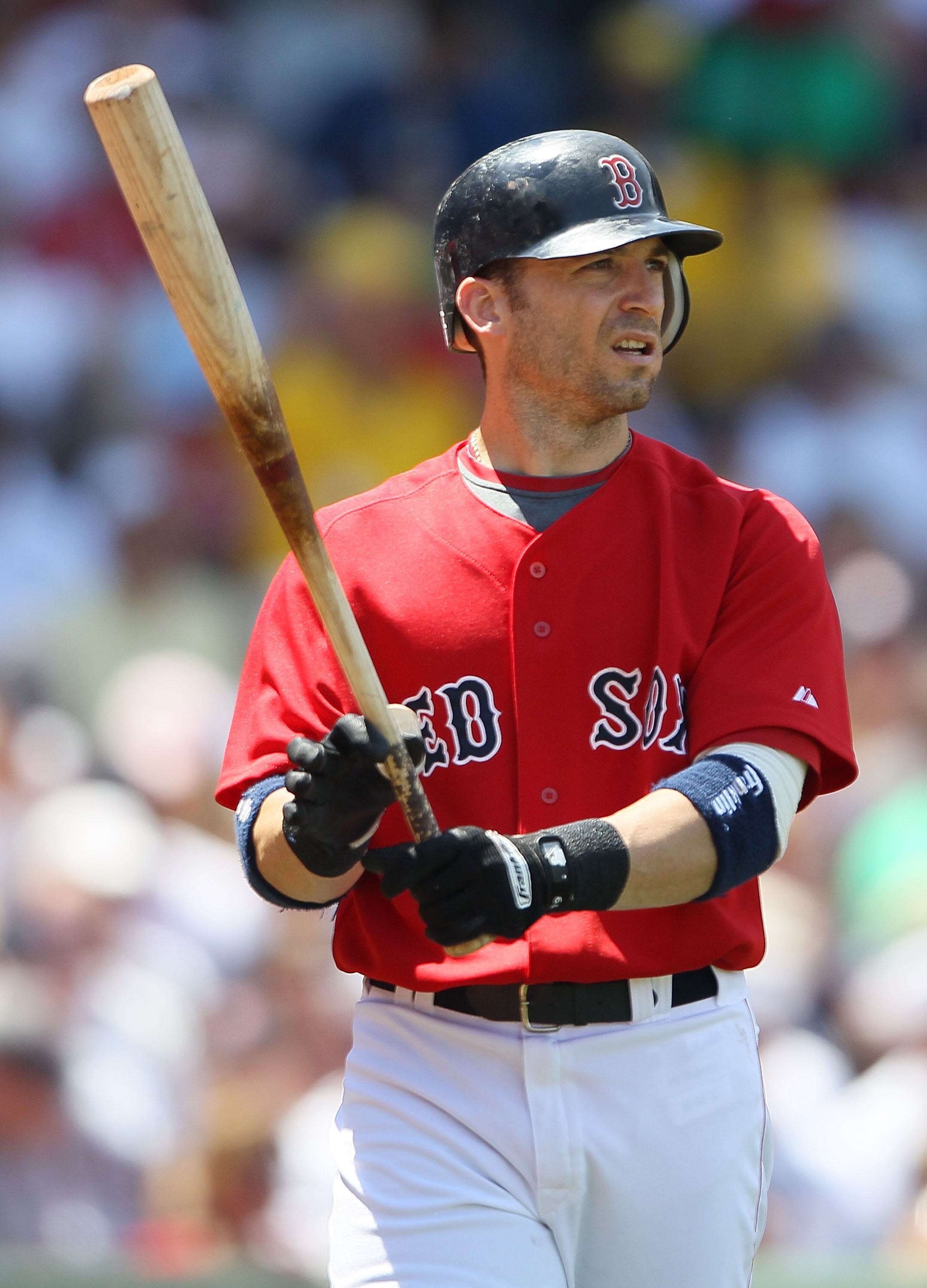 BOSTON - JULY 04:  Marco Scutaro #16 of the Boston Red Sox walks back to the dugout after striking out against the Baltimore Orioles on July 4, 2010 at Fenway Park in Boston, Massachusetts.  (Photo by Elsa/Getty Images)