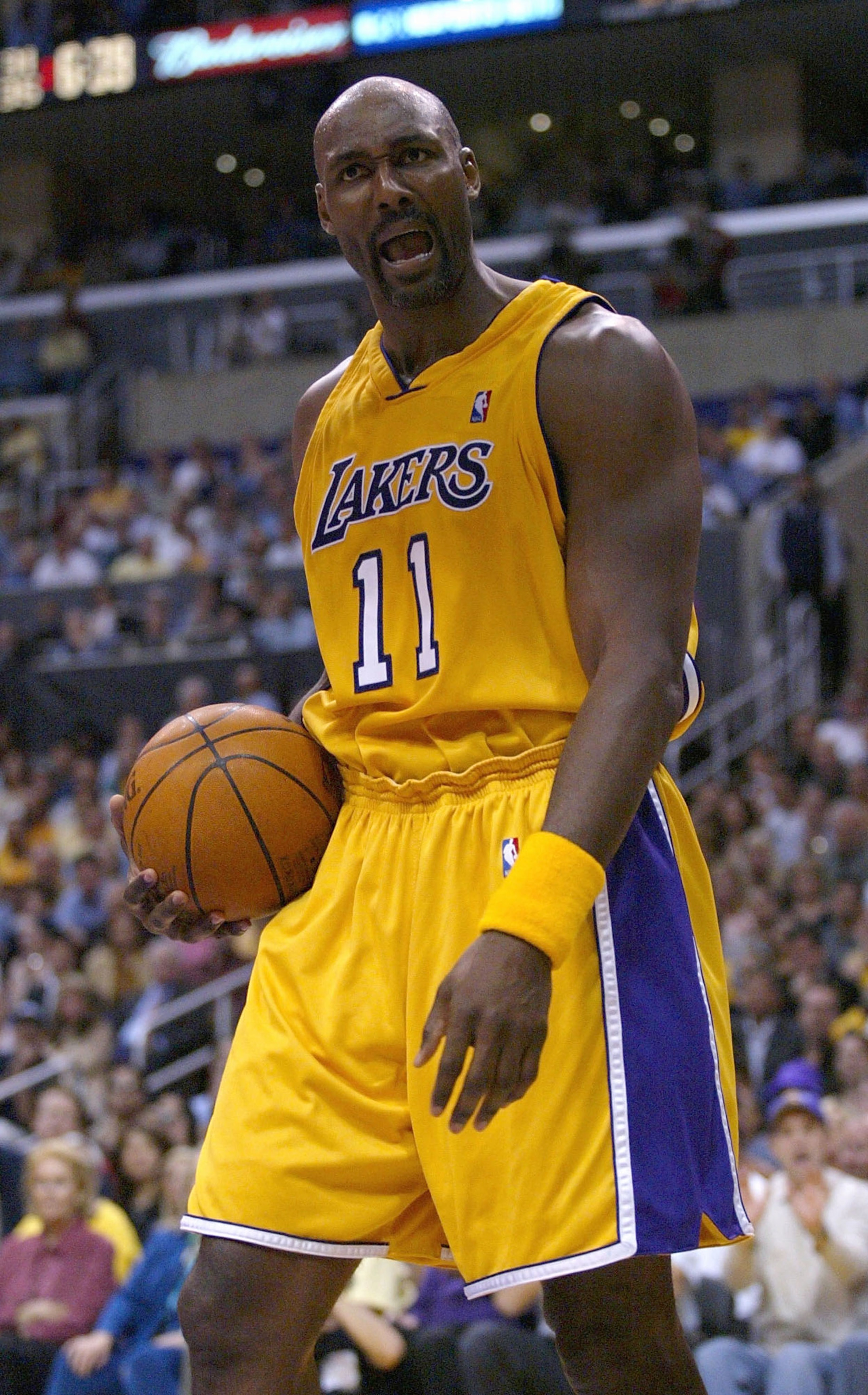 LOS ANGELES - MAY 11: Karl Malone #11 of the Los Angeles Lakers reacts to a call during Game four of the Western Conference Semifinals against the San Antonio Spurs during the 2004 NBA Playoffs at Staples Center on May 11, 2004 in Los Angeles, California LOS ANGELES - MAY 11: Karl Malone #11 of the Los Angeles Lakers reacts to a call during Game four of the Western Conference Semifinals against the San Antonio Spurs during the 2004 NBA Playoffs at Staples Center on May 11, 2004 in Los Angeles, California
