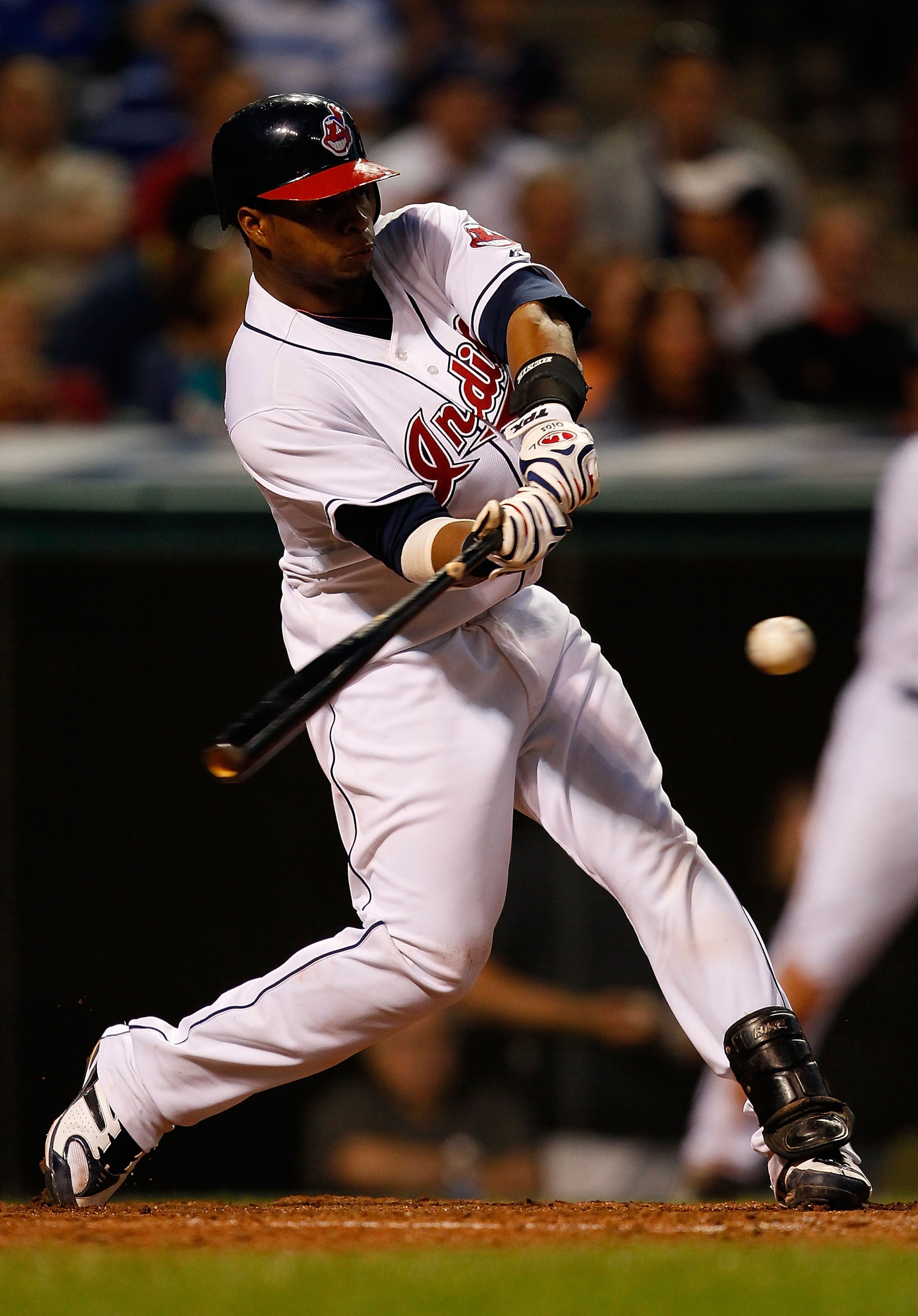 CLEVELAND - JUNE 17:  Carlos Santana #41 of the Cleveland Indians hits a triple against the New York Mets during the game on June 17, 2010 at Progressive Field in Cleveland, Ohio. Santana later went on to score.  (Photo by Jared Wickerham/Getty Images)