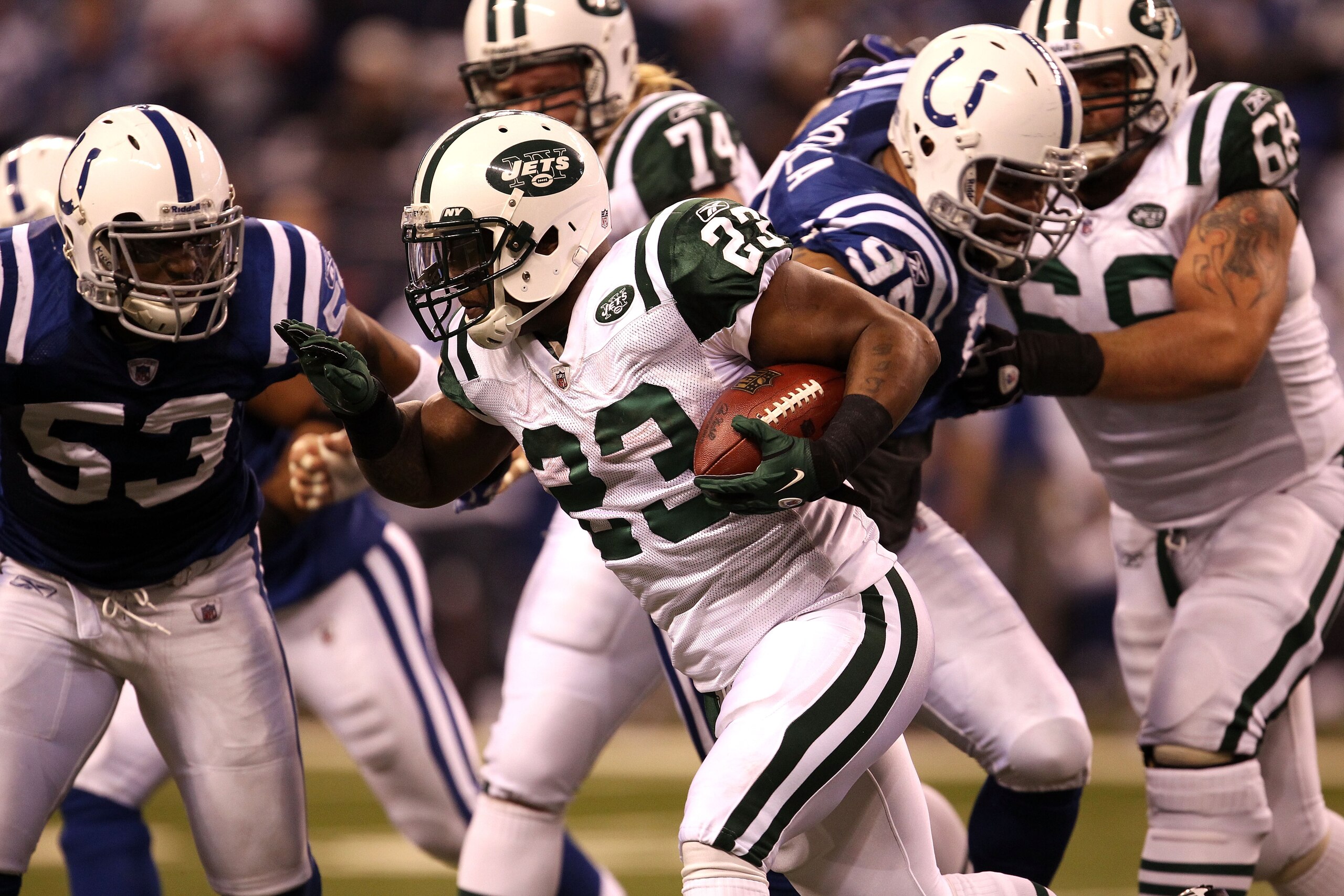 INDIANAPOLIS, IN - JANUARY 08:  Shonn Greene #23 of the New York Jets runs the ball against the Indianapolis Colts during their 2011 AFC wild card playoff game at Lucas Oil Stadium on January 8, 2011 in Indianapolis, Indiana. The Jets won 17-16. (Photo by