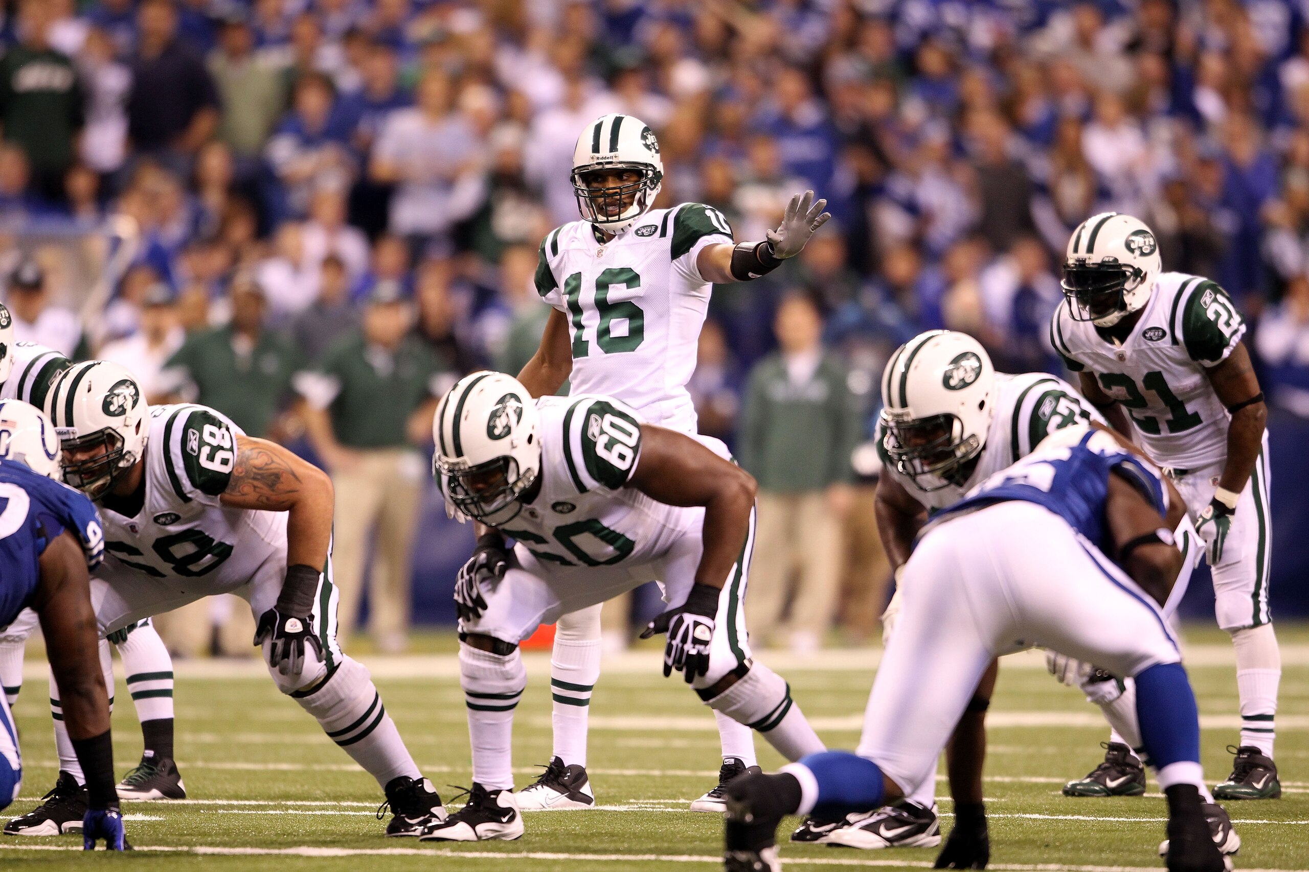 INDIANAPOLIS, IN - JANUARY 08:  Brad Smith #16 of the New York Jets gestures as he lines up in the wildcat formation at quarterback against the Indianapolis Colts during their 2011 AFC wild card playoff game at Lucas Oil Stadium on January 8, 2011 in Indi