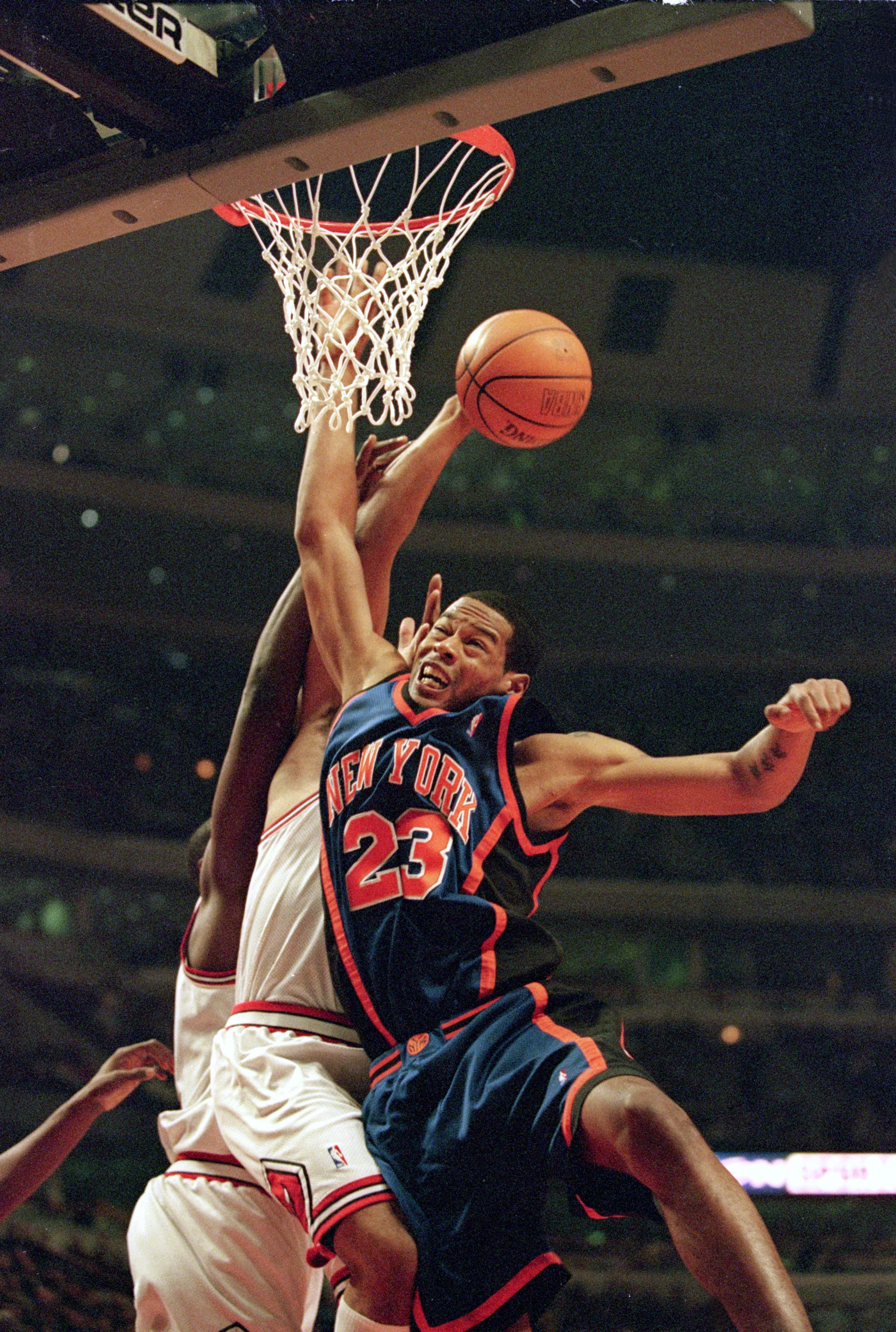 1 Dec 2000: Marcus Camby #23 of the New York Knicks slams the ball against Marcus Fizer #21 and Dragan Tarlac #12 of the Chicago Bulls during the game at the United Center in Chicago, Illinois. The Knicks defeated the Bulls 91-86. NOTE TO USER: It is e 1 Dec 2000: Marcus Camby #23 of the New York Knicks slams the ball against Marcus Fizer #21 and Dragan Tarlac #12 of the Chicago Bulls during the game at the United Center in Chicago, Illinois. The Knicks defeated the Bulls 91-86. NOTE TO USER: It is e