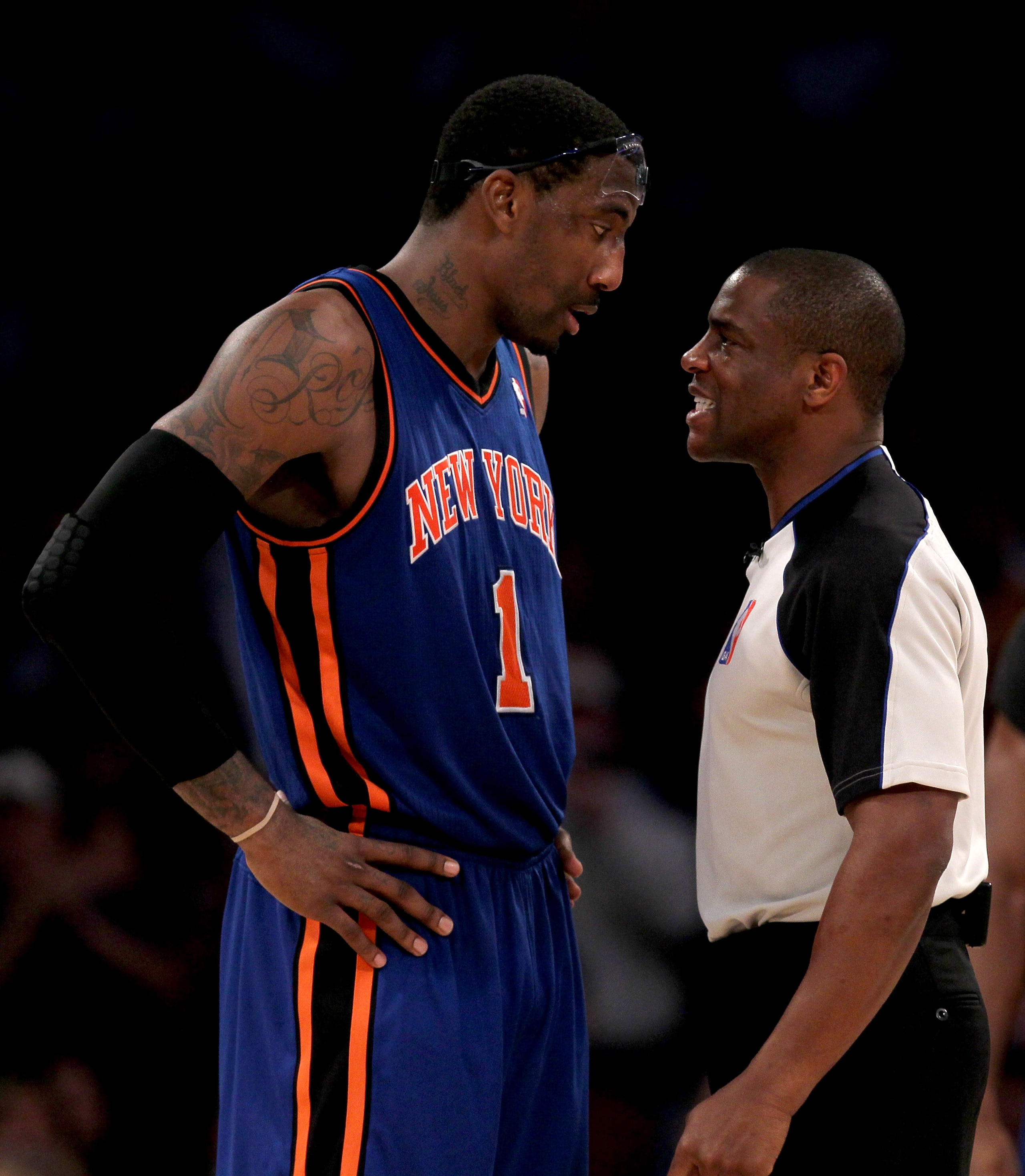 LOS ANGELES, CA - JANUARY 9:  Referee Tony Brown restrains Amar'e Stoudemire #1 of the New York Knicks after Stoudemire was knocked down on a flagrant foul in the game against the Los Angeles Lakers at Staples Center on January 9, 2011 in Los Angeles, Cal