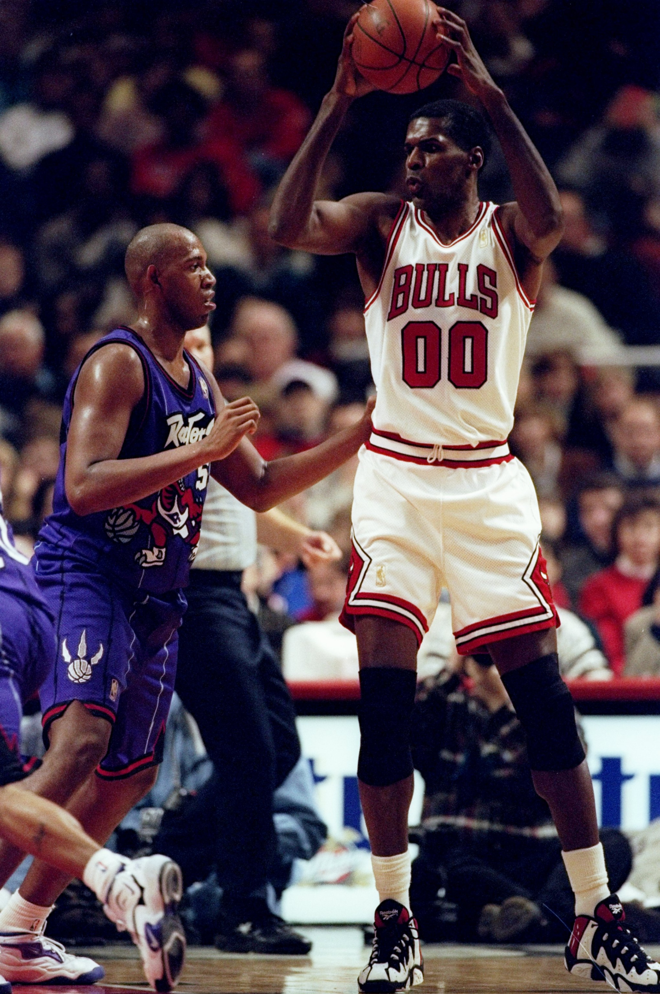 25 Jan 1997: Center Robert Parish of the Chicago Bulls (right) in action against forward Popeye Jones of the Toronto Raptors during a game at the United Center in Chicago, Illinois. The Bulls won the game 110-98. Mandatory Credit: Jonathan Daniel /Alls 25 Jan 1997: Center Robert Parish of the Chicago Bulls (right) in action against forward Popeye Jones of the Toronto Raptors during a game at the United Center in Chicago, Illinois. The Bulls won the game 110-98. Mandatory Credit: Jonathan Daniel /Alls
