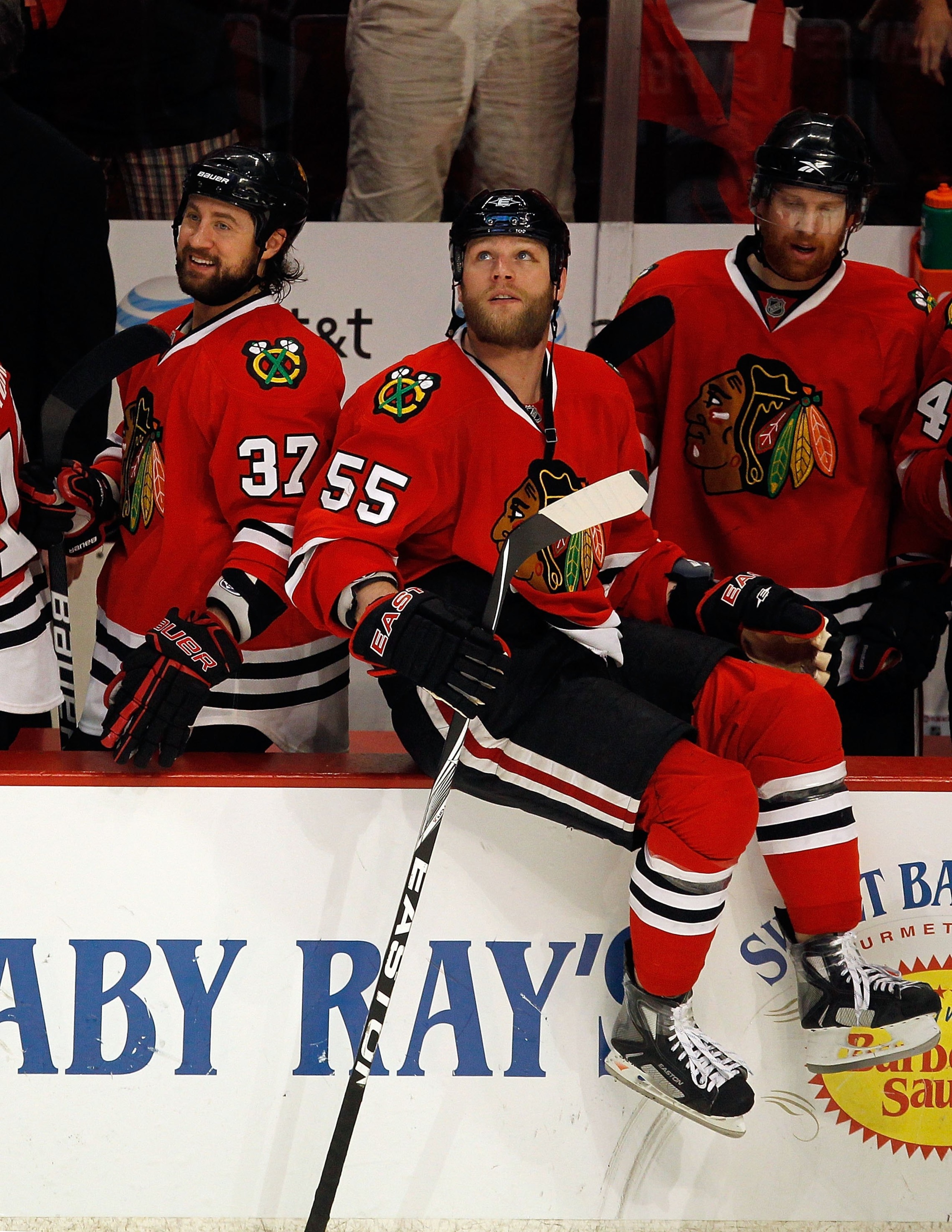 CHICAGO - MAY 23:  Adam Burish #37 and Ben Eager #55 of the Chicago Blackhawks look on from the bench while taking on the San Jose Sharks in Game Four of the Western Conference Finals during the 2010 NHL Stanley Cup Playoffs at the United Center on May 23