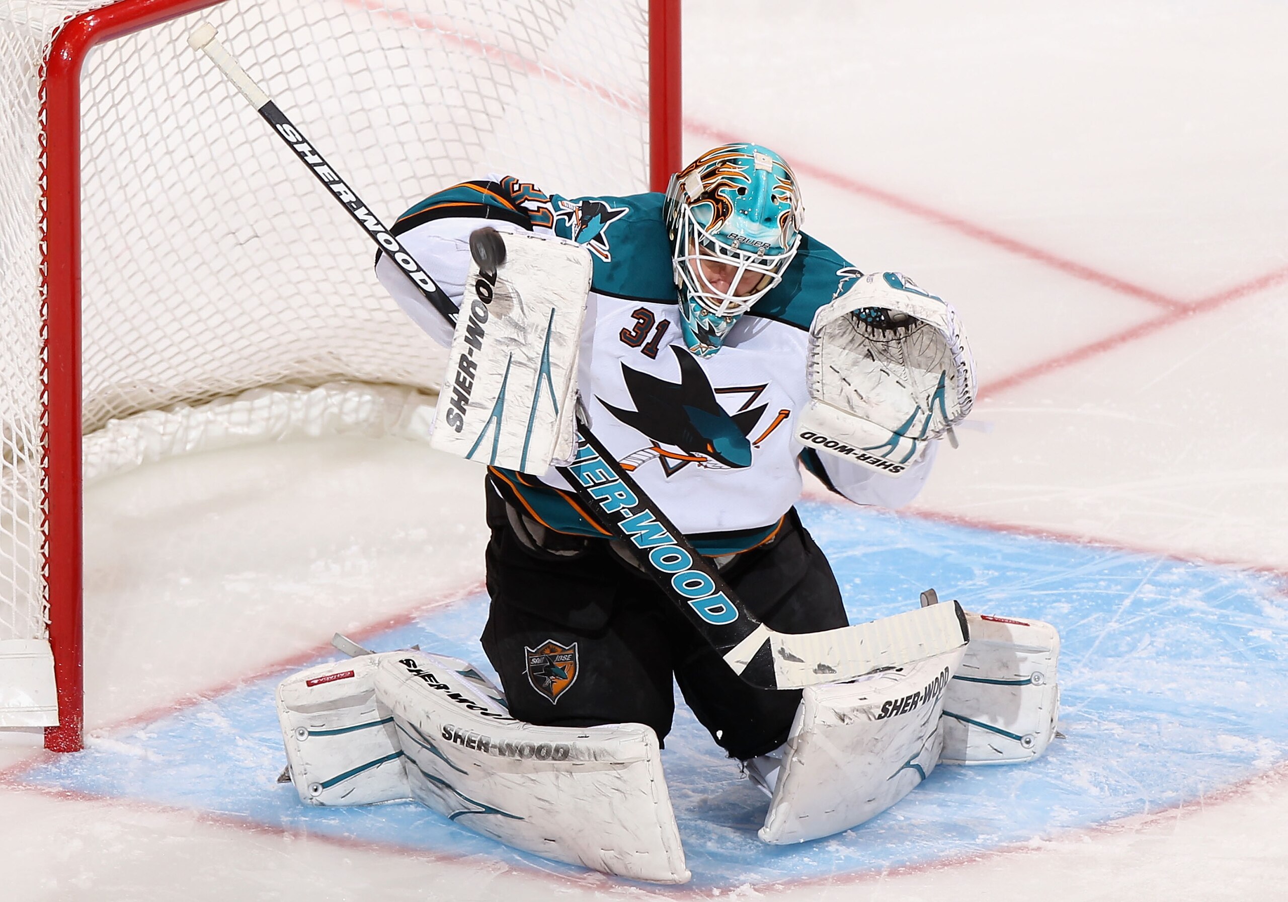 GLENDALE, AZ - JANUARY 17:  Goaltender Antti Niemi #31 of the San Jose Sharks makes a blocker save on the shot from the Phoenix Coyotes during the second period of the NHL game at Jobing.com Arena on January 17, 2011 in Glendale, Arizona.  (Photo by Chris
