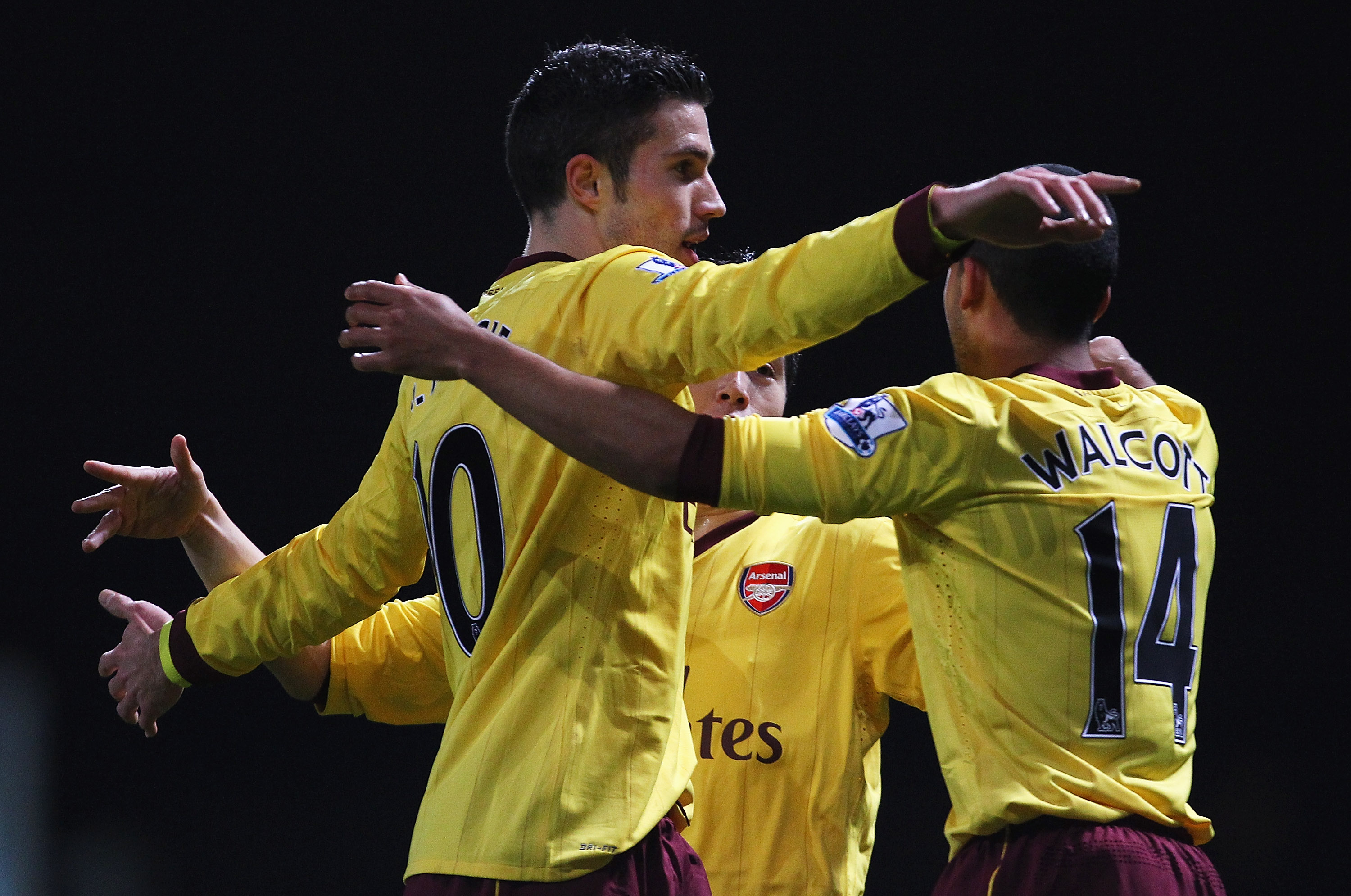 LONDON, ENGLAND - JANUARY 15:  Robin van Persie of Arsenal celebrates scoring the opening goal with Theo Walcott during the Barclays Premier League match between West Ham United and Arsenal at the Boleyn Ground on January 15, 2011 in London, England.  (Ph