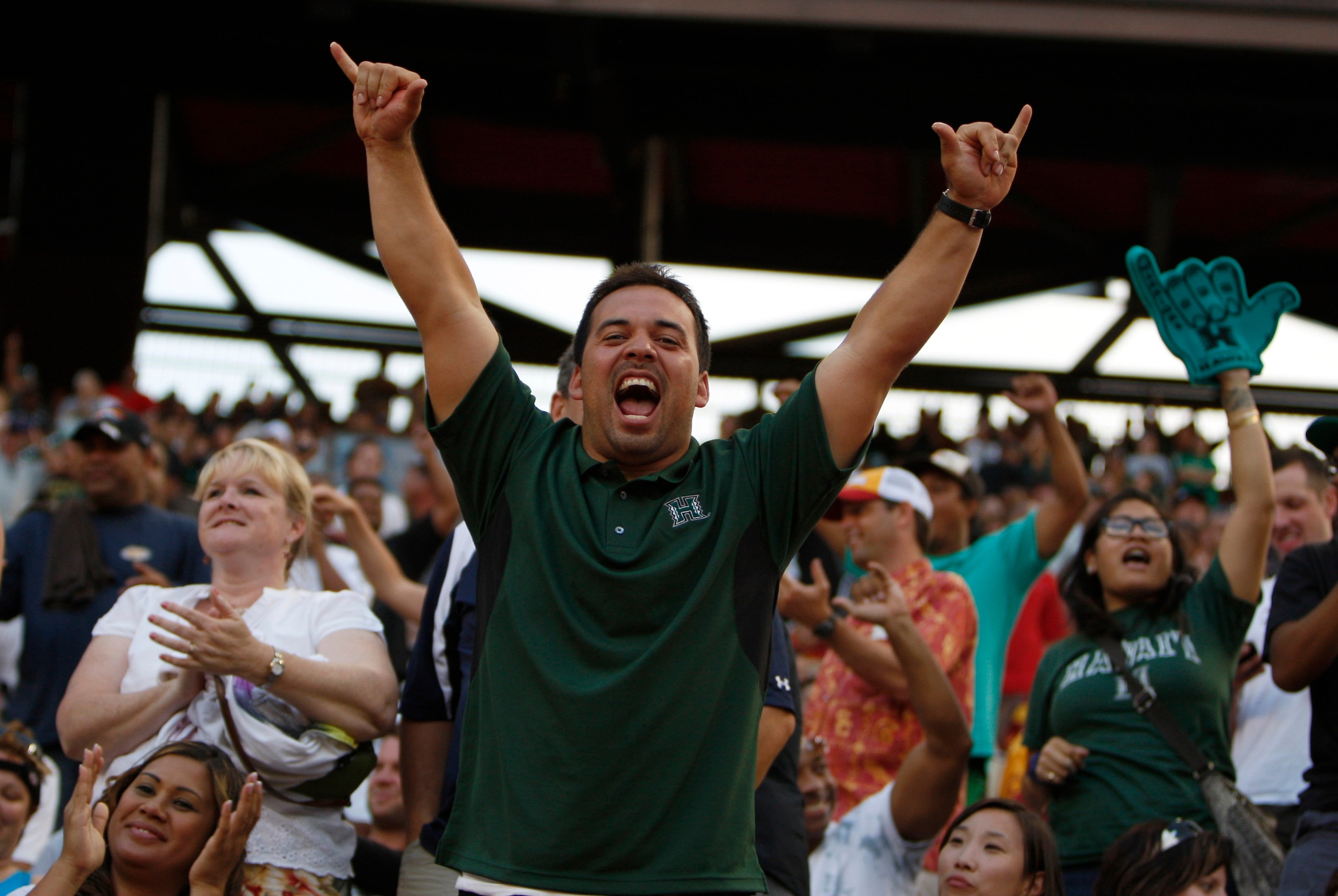 HONOLULU - SEPTEMBER 02: Fans cheer during first half action at Aloha Stadium September 2, 2010 in Honolulu, Hawaii. (Photo by Kent Nishimura/Getty Images)