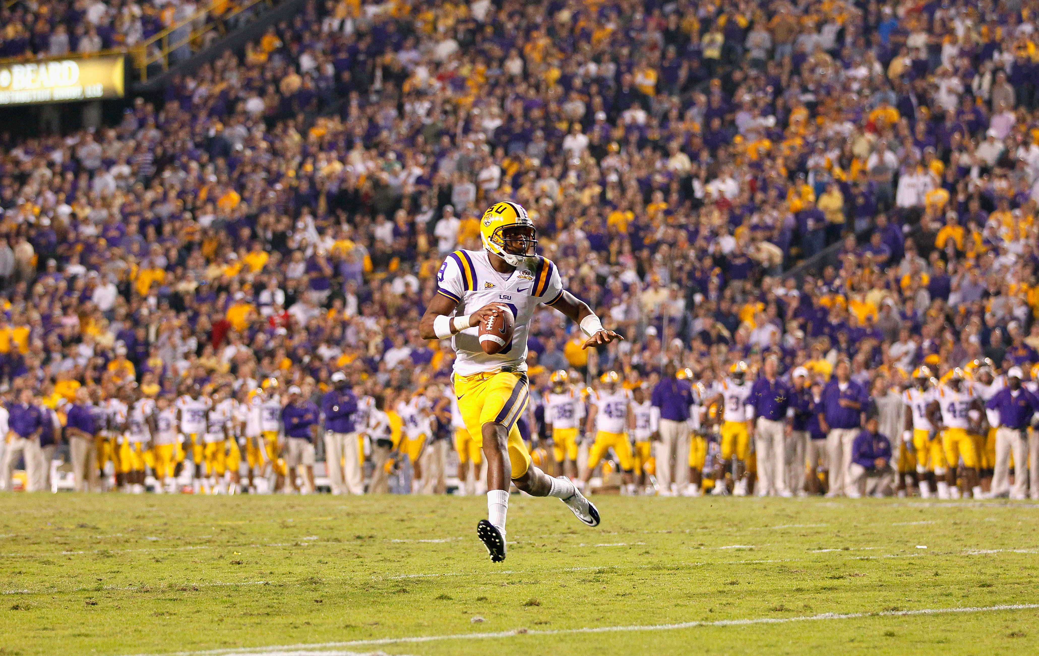 BATON ROUGE, LA - NOVEMBER 20:  Quarterback Jordan Jefferson #9 of the Louisiana State University Tigers rushes out of the pocket against the Ole Miss Rebels at Tiger Stadium on November 20, 2010 in Baton Rouge, Louisiana.  (Photo by Kevin C. Cox/Getty Im