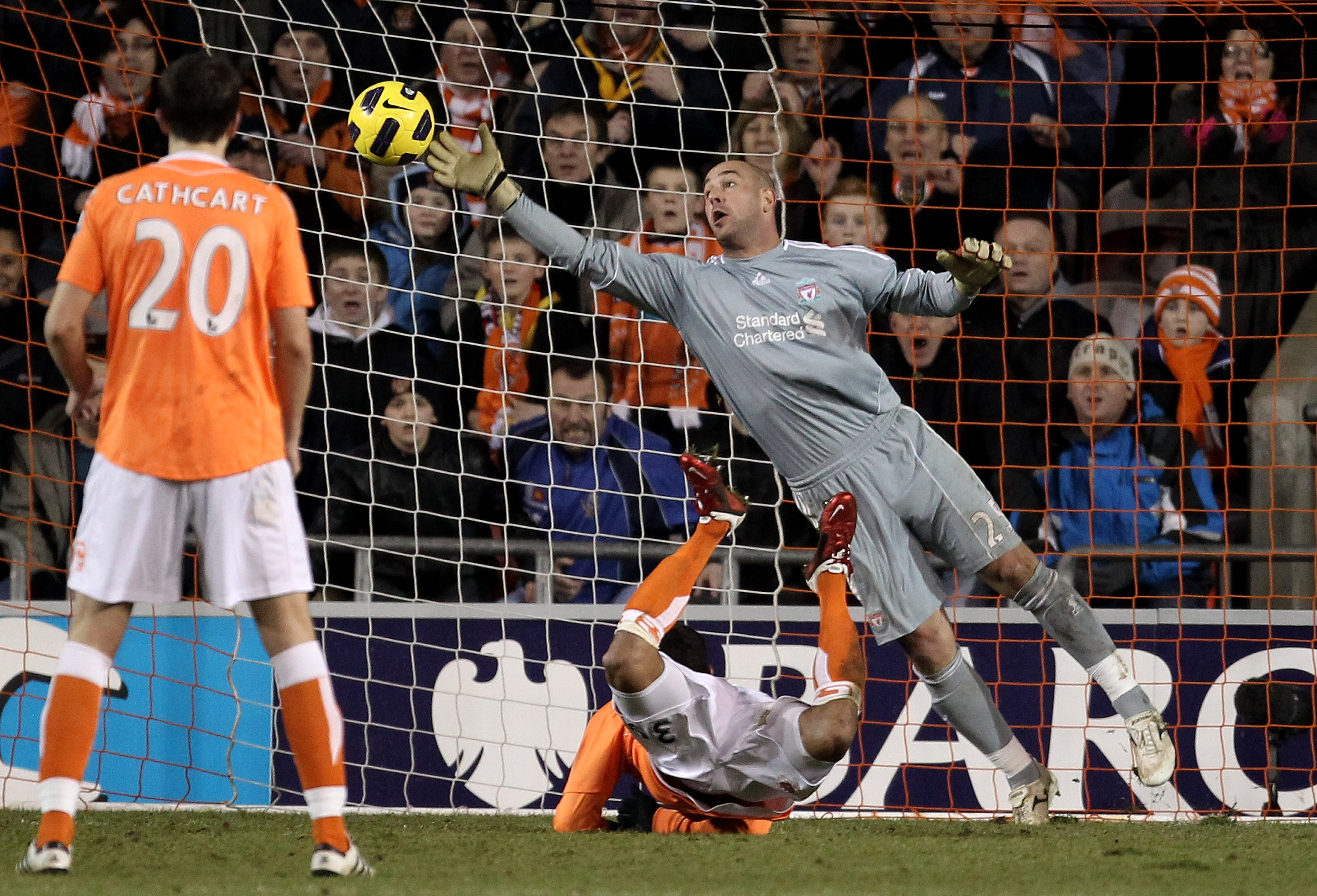 BLACKPOOL, ENGLAND - JANUARY 12:  Pepe Reina of Liverpool is unable to stop DJ Campbell of Blackpool scoring his team's second goal during the Barclays Premier League match between Blackpool and Liverpool at Bloomfield Road on January 12, 2011 in Blackpoo