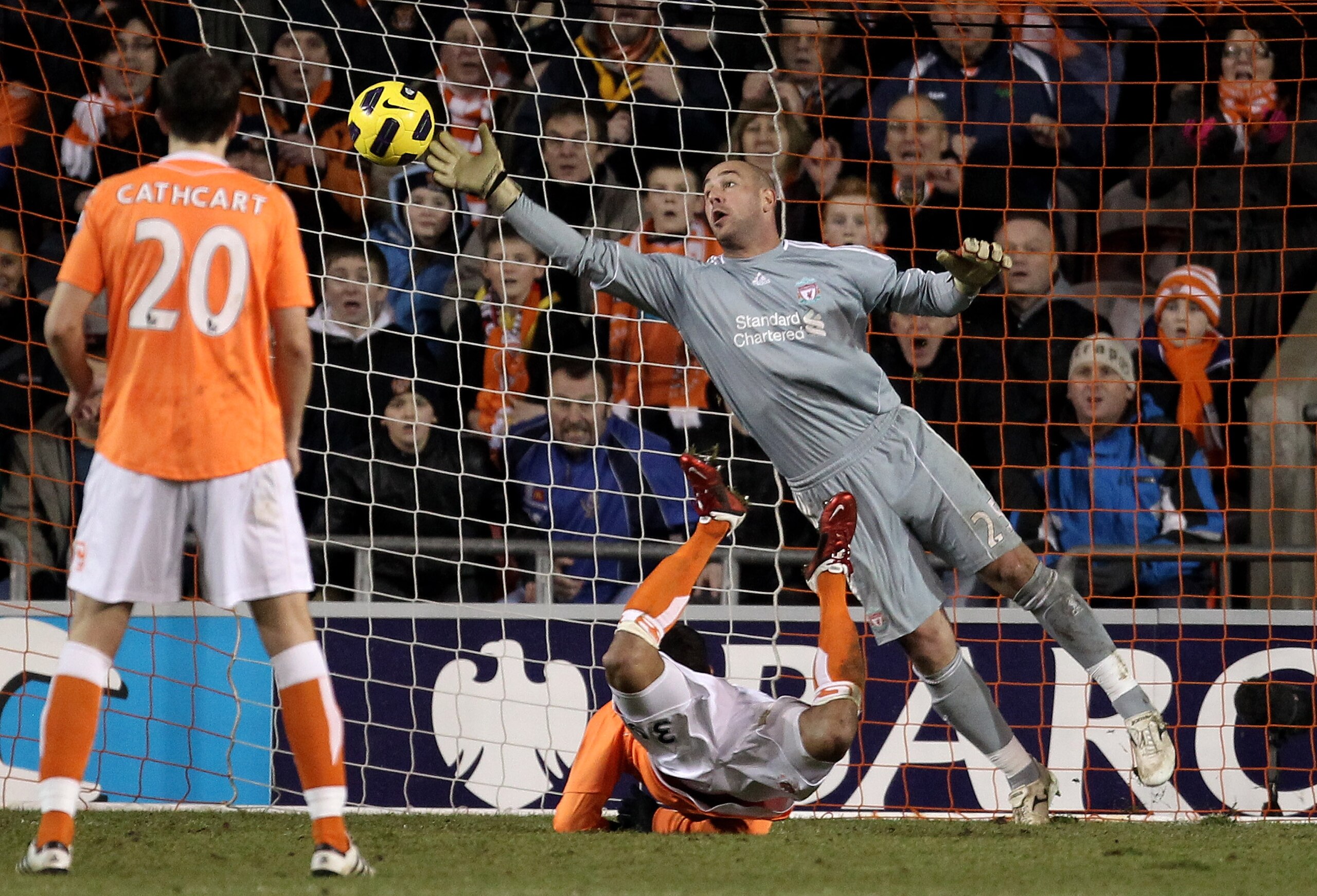 BLACKPOOL, ENGLAND - JANUARY 12:  Pepe Reina of Liverpool is unable to stop DJ Campbell of Blackpool scoring his team's second goal during the Barclays Premier League match between Blackpool and Liverpool at Bloomfield Road on January 12, 2011 in Blackpoo