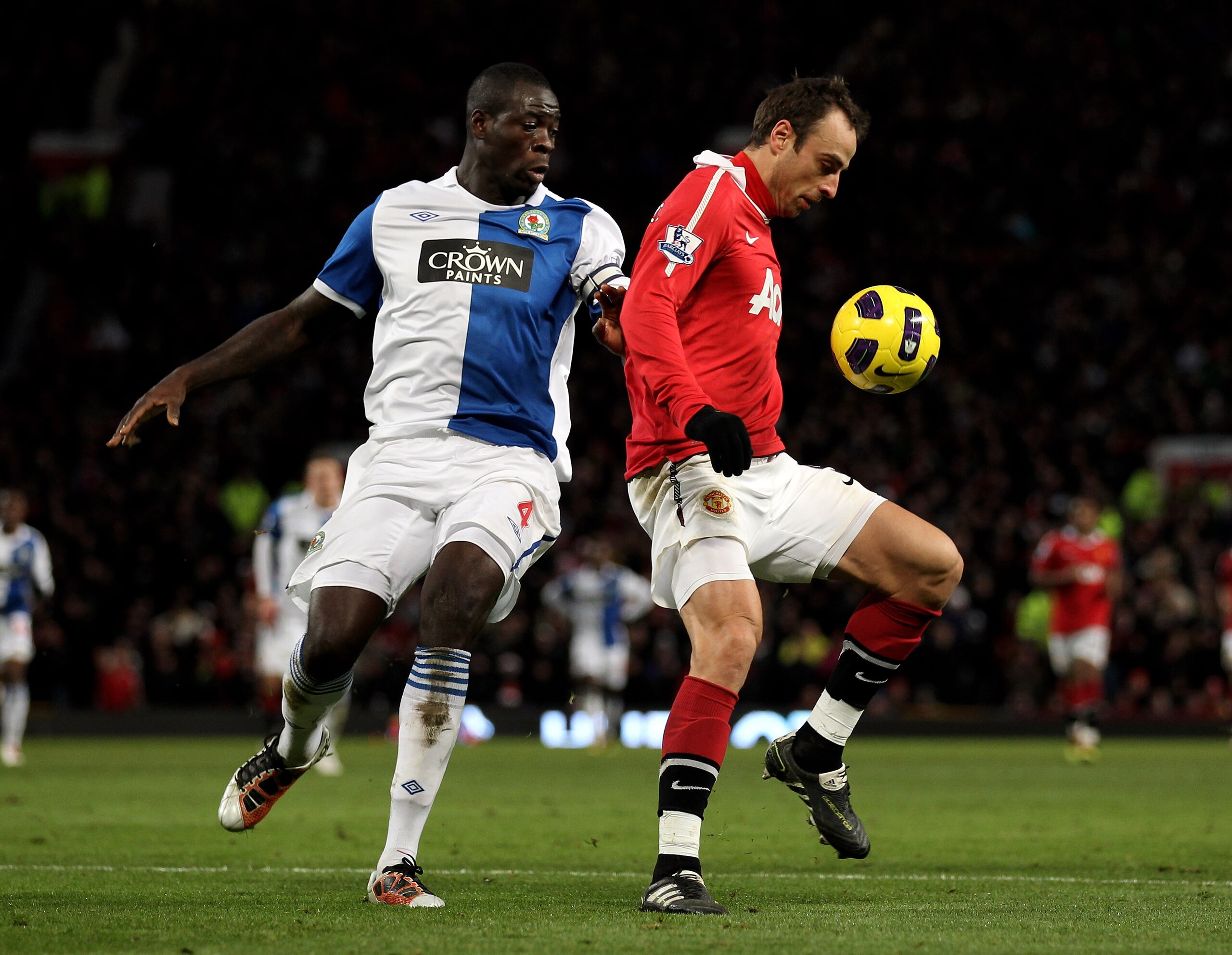 MANCHESTER, ENGLAND - NOVEMBER 27:  Dimitar Berbatov of Manchester United competes with Chris Samba of Blackburn Rovers during the Barclays Premier League match between Manchester United and Blackburn Rovers at Old Trafford on November 27, 2010 in Manches