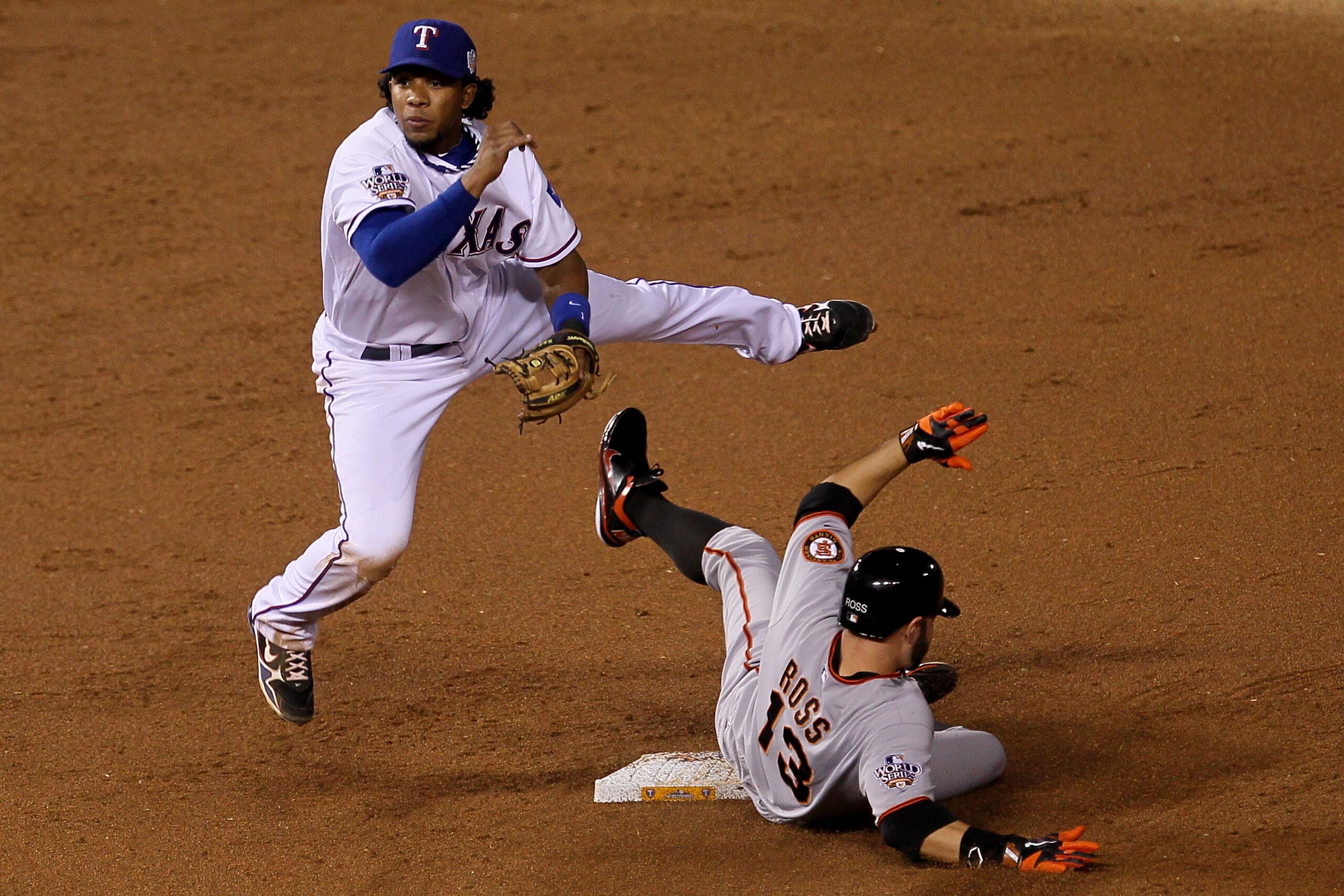 ARLINGTON, TX - OCTOBER 31:  Elvis Andrus #1 of the Texas Rangers forces out Cody Ross #13 of the San Francisco Giants on a fielder's choice hit by Travis Ishikawa #10 in the second ining of Game Four of the 2010 MLB World Series at Rangers Ballpark in Ar
