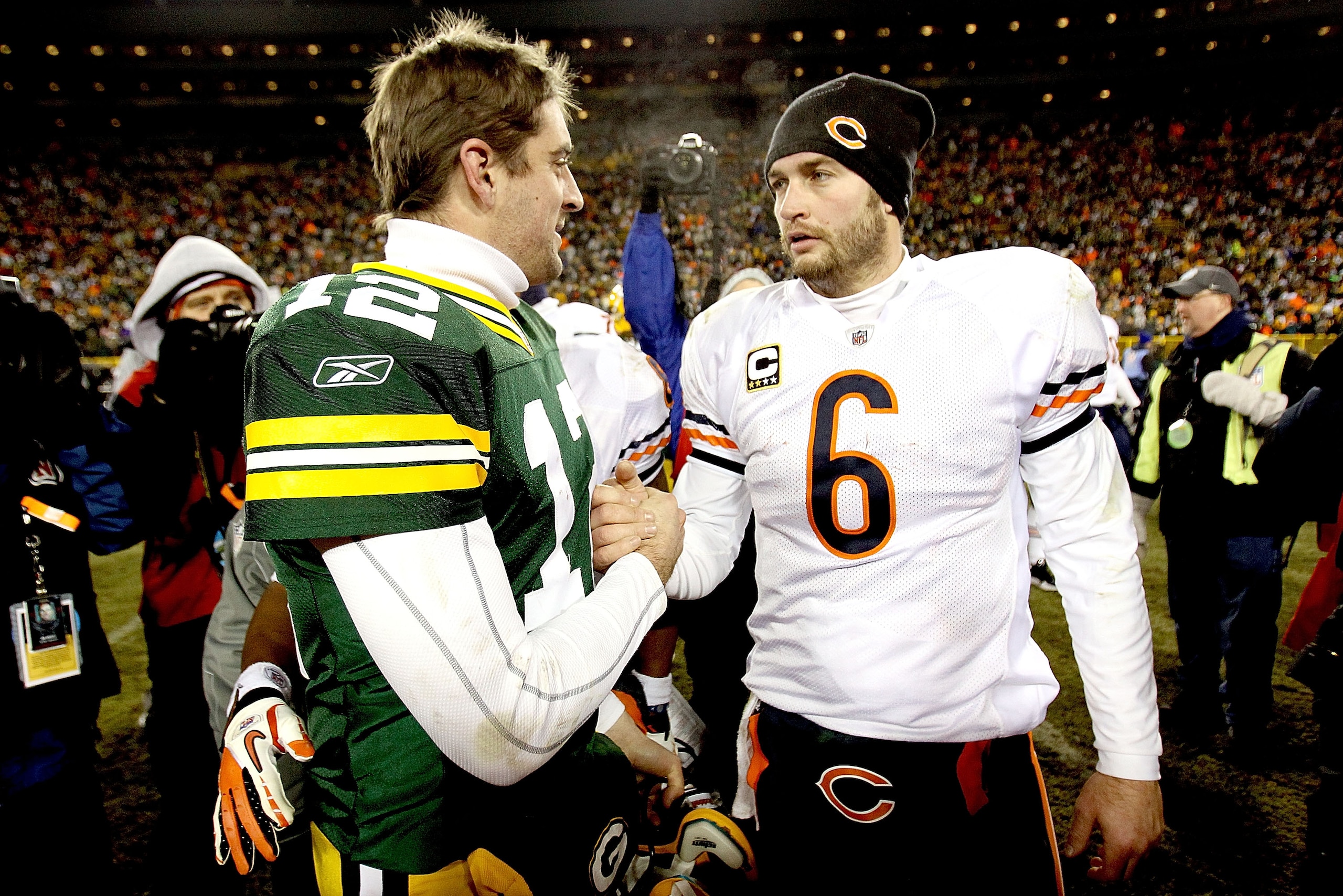 GREEN BAY, WI - JANUARY 02:  Quarterback Aaron Rodgers #12 of the Green Bay Packers is congratukated by quarterback Jay Cutler #6 of the Chicago Bears at Lambeau Field on January 2, 2011 in Green Bay, Wisconsin.  (Photo by Matthew Stockman/Getty Images)