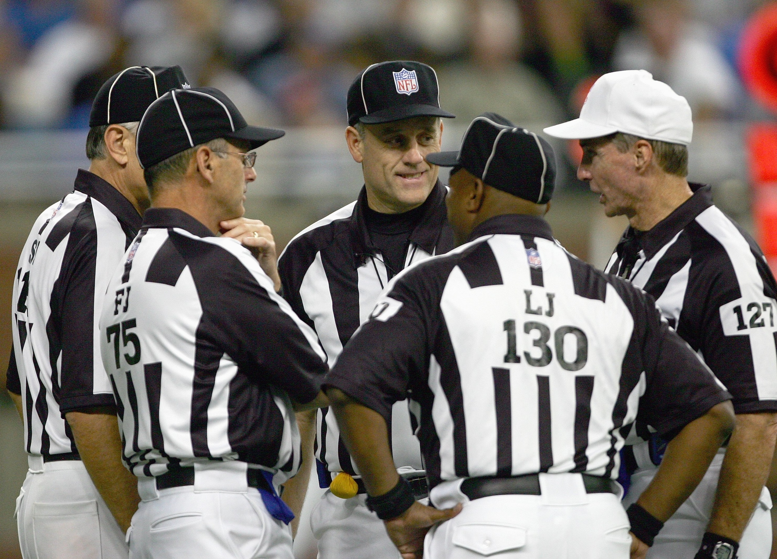 DETROIT - SEPTEMBER 16: Umpire Richard Hall#49 talks with line judges Darryll Lewis #130. Bill Leavy#127 and field judge Rob Vernatchi(75) during the game between the Minnesota Vikings and the Detroit Lions at Ford Field on September 16, 2006 in Detroit, DETROIT - SEPTEMBER 16: Umpire Richard Hall#49 talks with line judges Darryll Lewis #130. Bill Leavy#127 and field judge Rob Vernatchi(75) during the game between the Minnesota Vikings and the Detroit Lions at Ford Field on September 16, 2006 in Detroit,