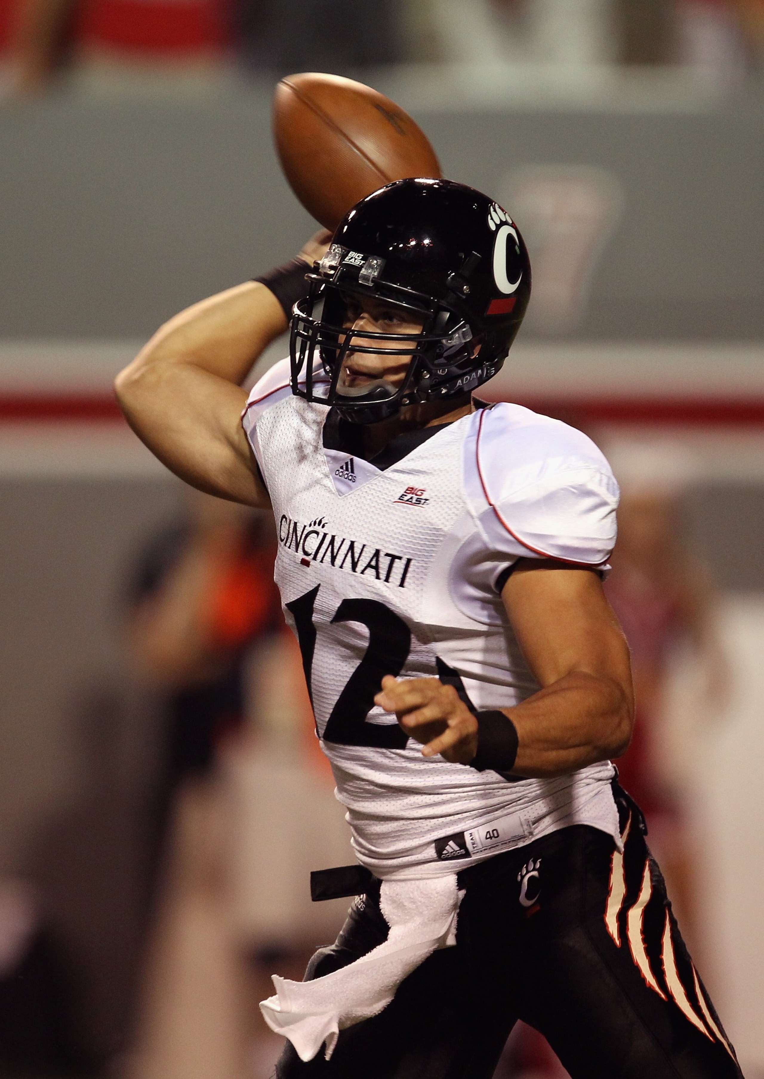 RALEIGH, NC - SEPTEMBER 16:  Zack Collaros #12 of the Cincinnati Bearcats throws a pass against the North Carolina State Wolfpack during their game at Carter-Finley Stadium on September 16, 2010 in Raleigh, North Carolina.  (Photo by Streeter Lecka/Getty