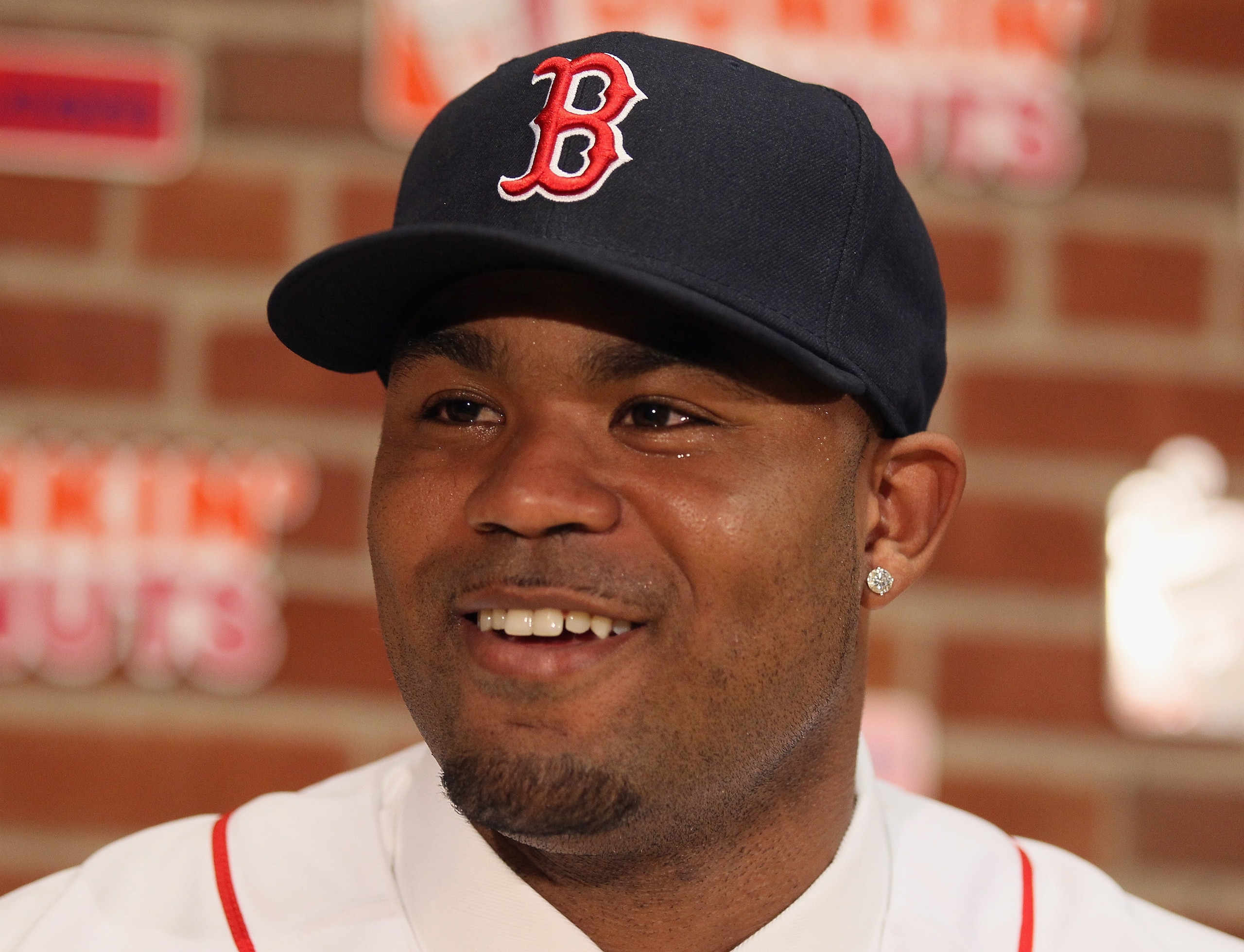 BOSTON, MA - DECEMBER 11:  Carl Crawford answers questions during a press conference announcing his signing with the Boston Red Sox on December 11,  2010 at the Fenway Park in Boston, Massachusetts.  (Photo by Elsa/Getty Images)