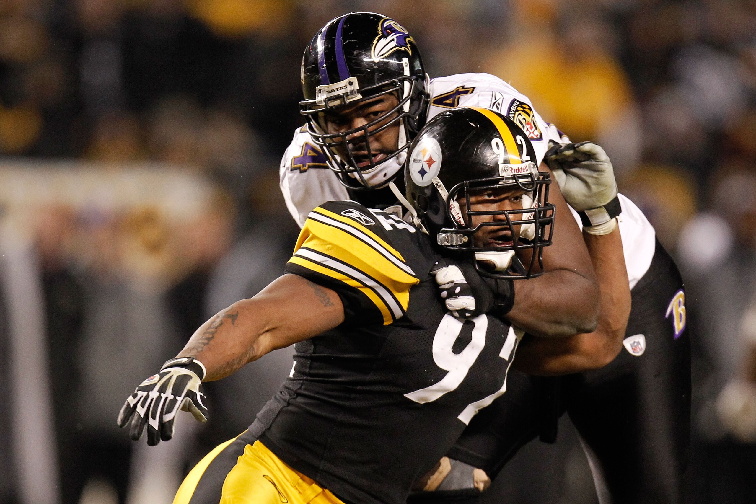 PITTSBURGH, PA - JANUARY 15:  Linebacker James Harrison #92 of the Pittsburgh Steelers rushes against offensive tackle Michael Oher #74 of the Baltimore Ravens during the AFC Divisional Playoff Game at Heinz Field on January 15, 2011 in Pittsburgh, Pennsy