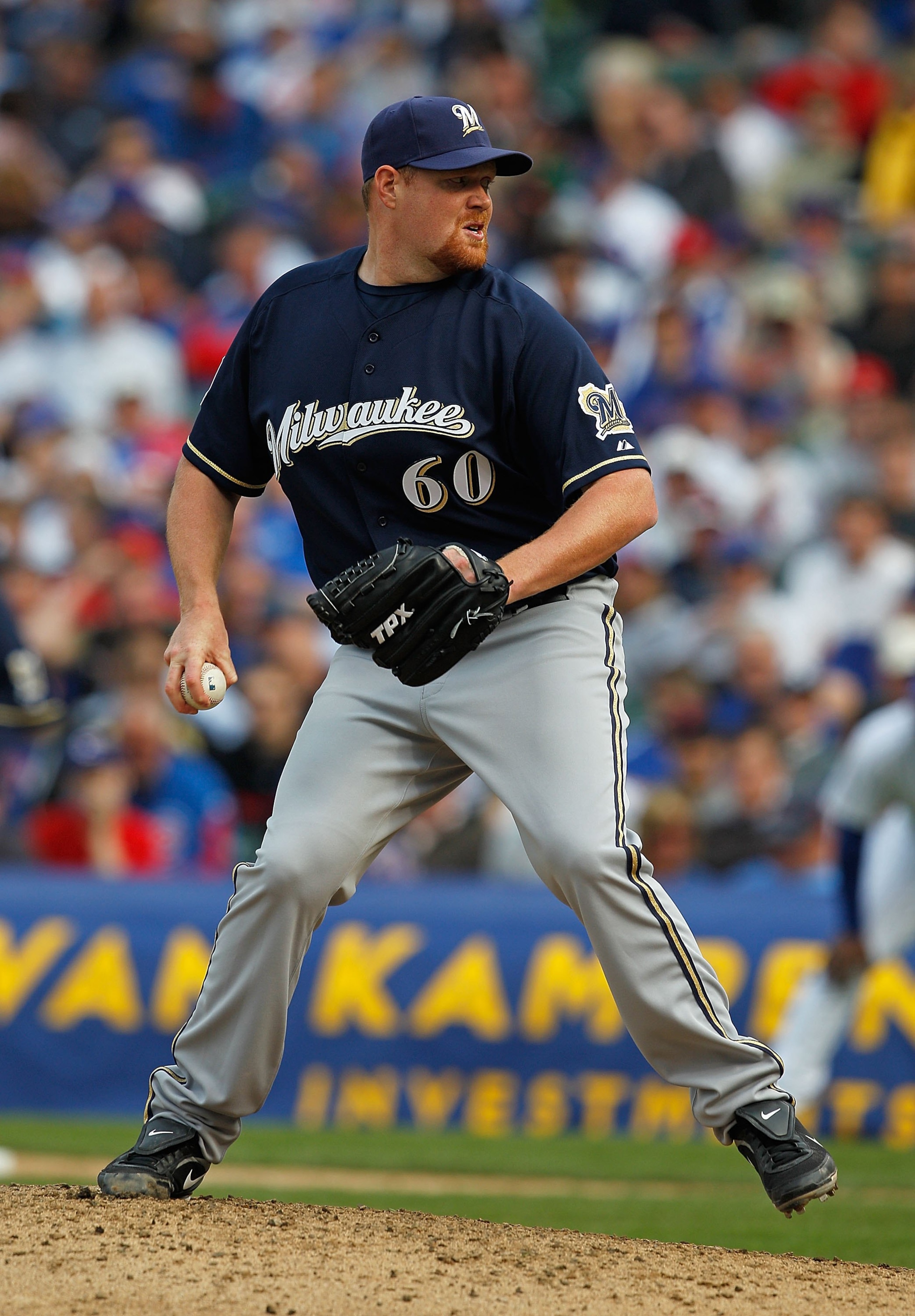 CHICAGO - APRIL 12: Todd Coffey #60 of the Milwaukee Brewers delivers the ball against the Chicago Cubs on Opening Day at Wrigley Field on April 12, 2010 in Chicago, Illinois. The Cubs defeated the Brewers 9-5. (Photo by Jonathan Daniel/Getty Images)