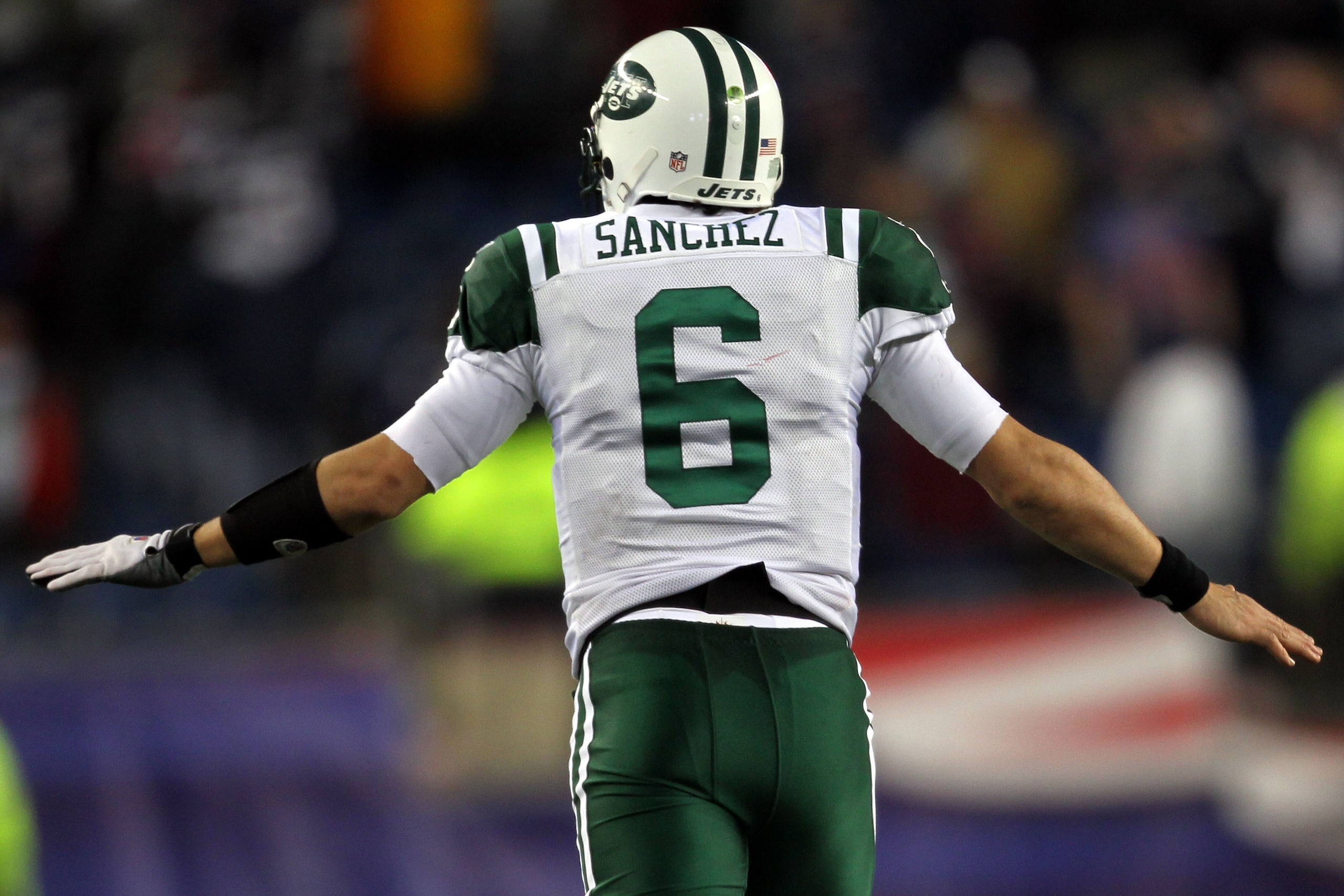 FOXBORO, MA - JANUARY 16:  Mark Sanchez #6 of the New York Jets celebrates after a touchdown late in the fourth quarter against the New England Patriots during their 2011 AFC divisional playoff game at Gillette Stadium on January 16, 2011 in Foxboro, Mass