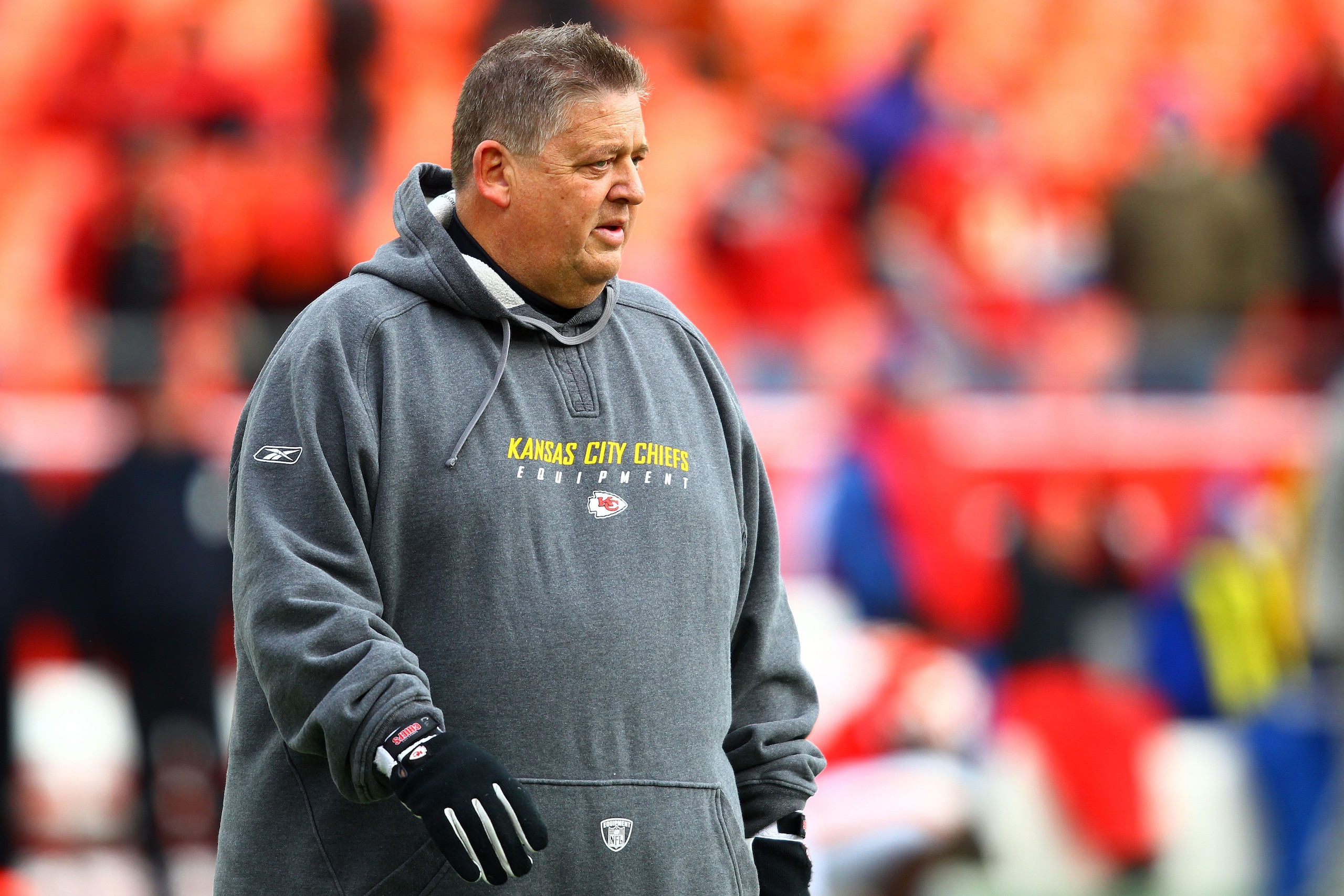 KANSAS CITY, MO - JANUARY 09:  Offensive coordinator Charlie Weis of the Kansas City Chiefs walks in the field prior to playing the Baltimore Ravens in their 2011 AFC wild card playoff game at Arrowhead Stadium on January 9, 2011 in Kansas City, Missouri.