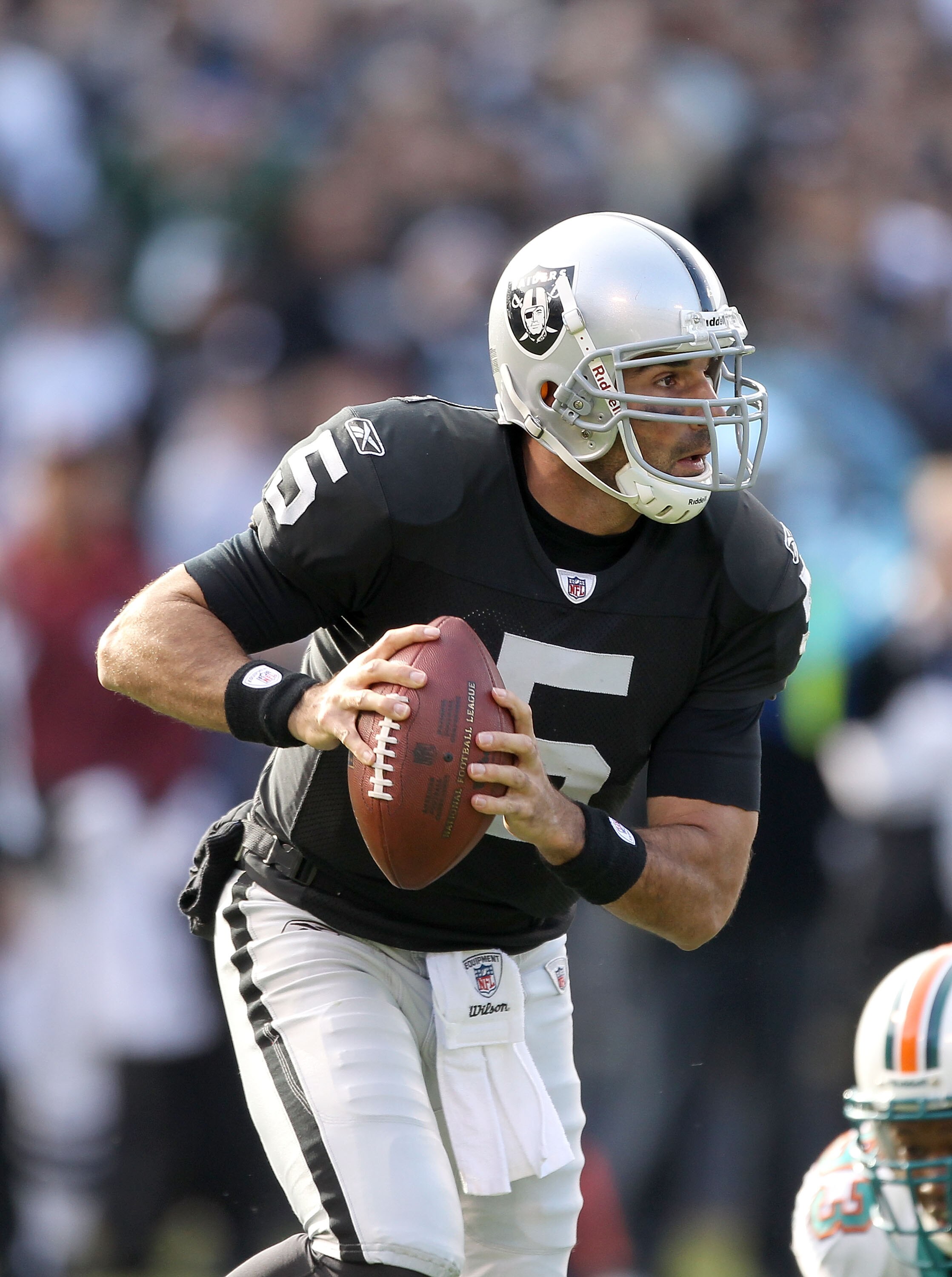 OAKLAND, CA - NOVEMBER 28:  Bruce Gradkowski #5 of the Oakland Raiders in action against the Miami Dolphins at Oakland-Alameda County Coliseum on November 28, 2010 in Oakland, California.  (Photo by Ezra Shaw/Getty Images)