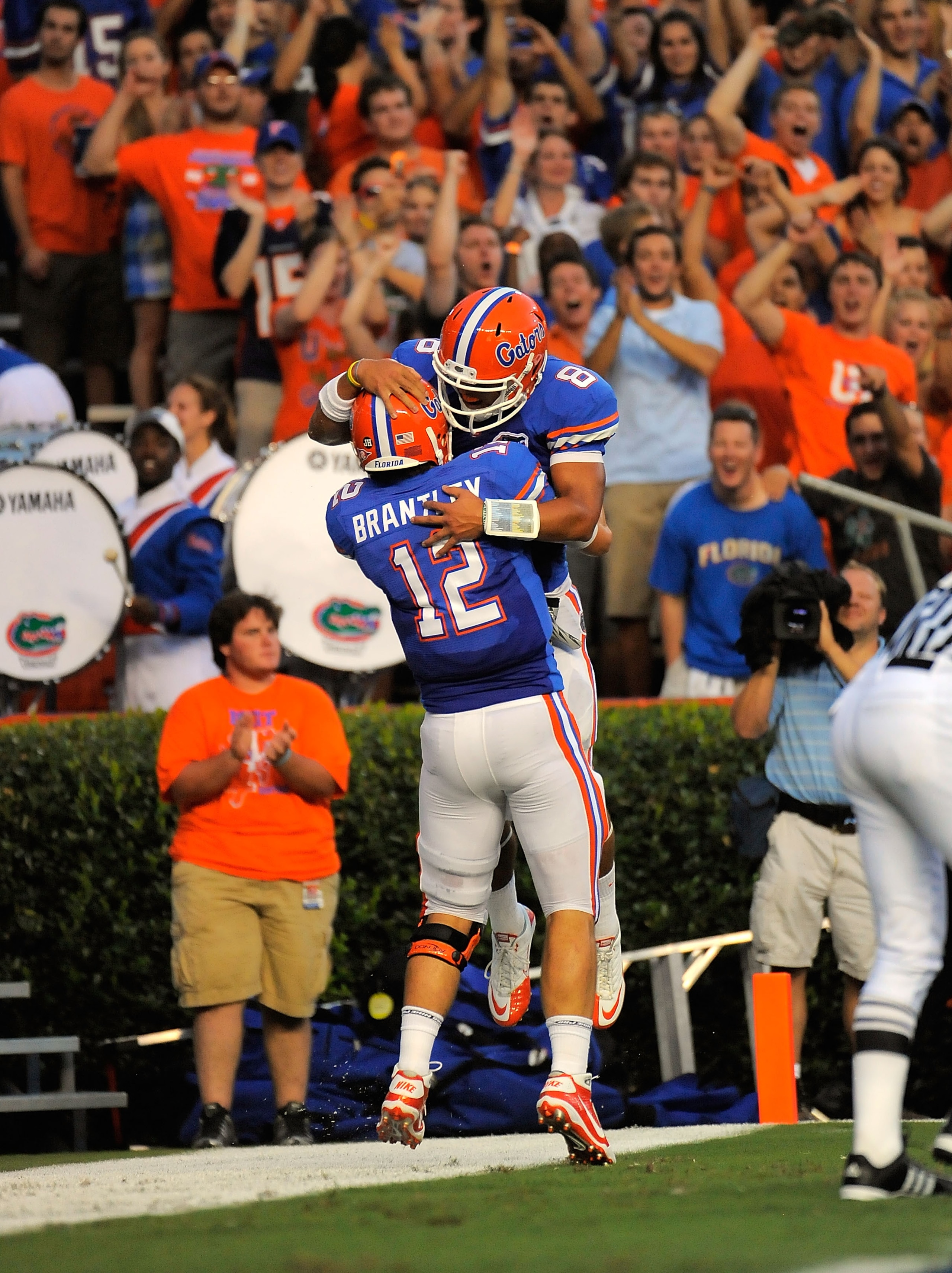 GAINESVILLE, FL - SEPTEMBER 25:  Quarterback John Brantley #12 and half back Trey Burton #8 of the Florida Gators celebrate Burton's touchdown against the Kentucky Wildcats at Ben Hill Griffin Stadium on September 25, 2010 in Gainesville, Florida.  (Photo