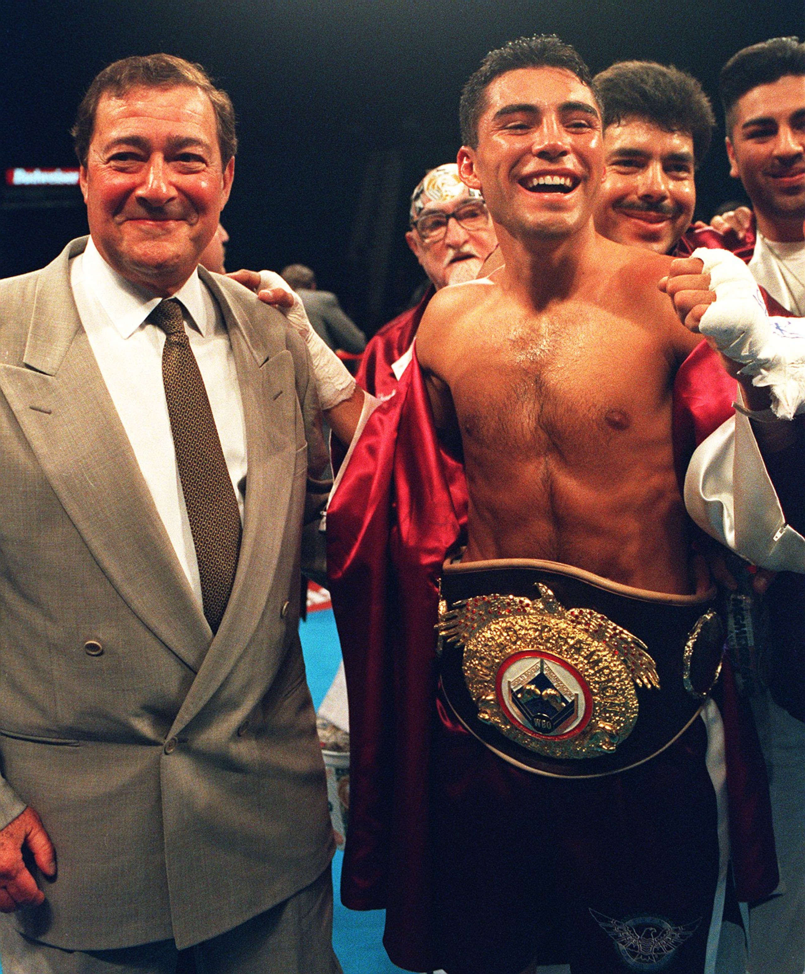 27 May 1994: Oscar De La Hoya Celebrates with promoter Bob Arum after retaining his WBO Junior Lightweight Belt against challenger Giorgio Campanella at the MGM Grand Hotel in Las Vegas.