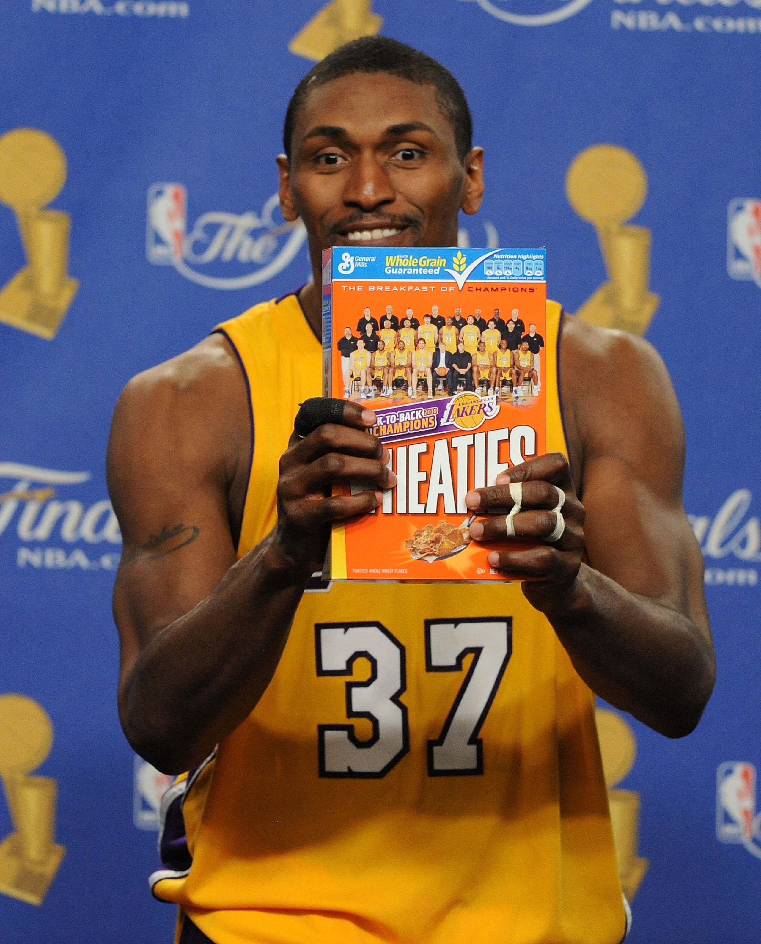 LOS ANGELES, CA - JUNE 17:  Ron Artest #37 of the Los Angeles Lakers holds up a Wheaties box during the post game news conference as he celebrates after the Lakers defeated the Boston Celtics 83-79 in Game Seven of the 2010 NBA Finals at Staples Center on