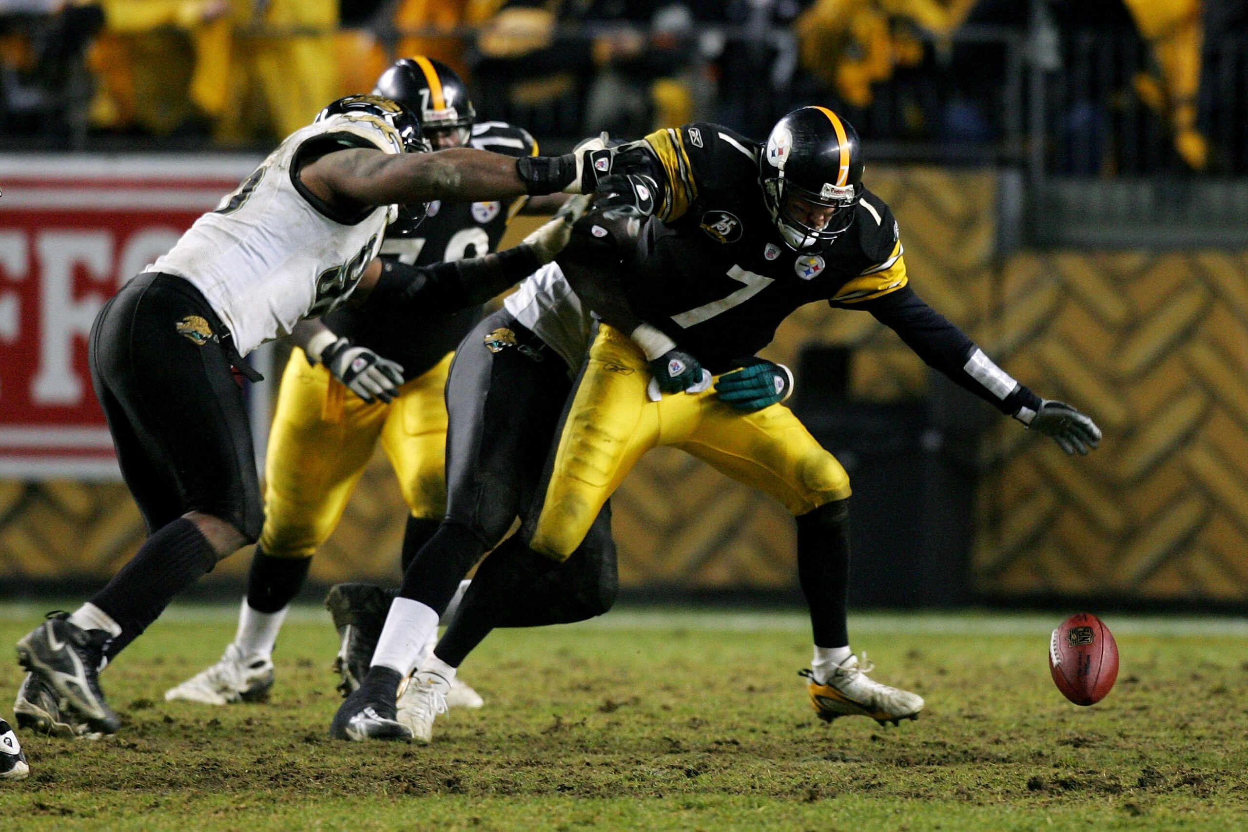 PITTSBURGH - JANUARY 05:  Ben Roethlisberger #7 of the Pittsburgh Steelers fumbles the ball as he is tackled by Bobby McCray #93 of the Jacksonville Jaguars on the Steelers' final drive during the AFC Wild Card game on January 5, 2008 at Heinz Field in Pi