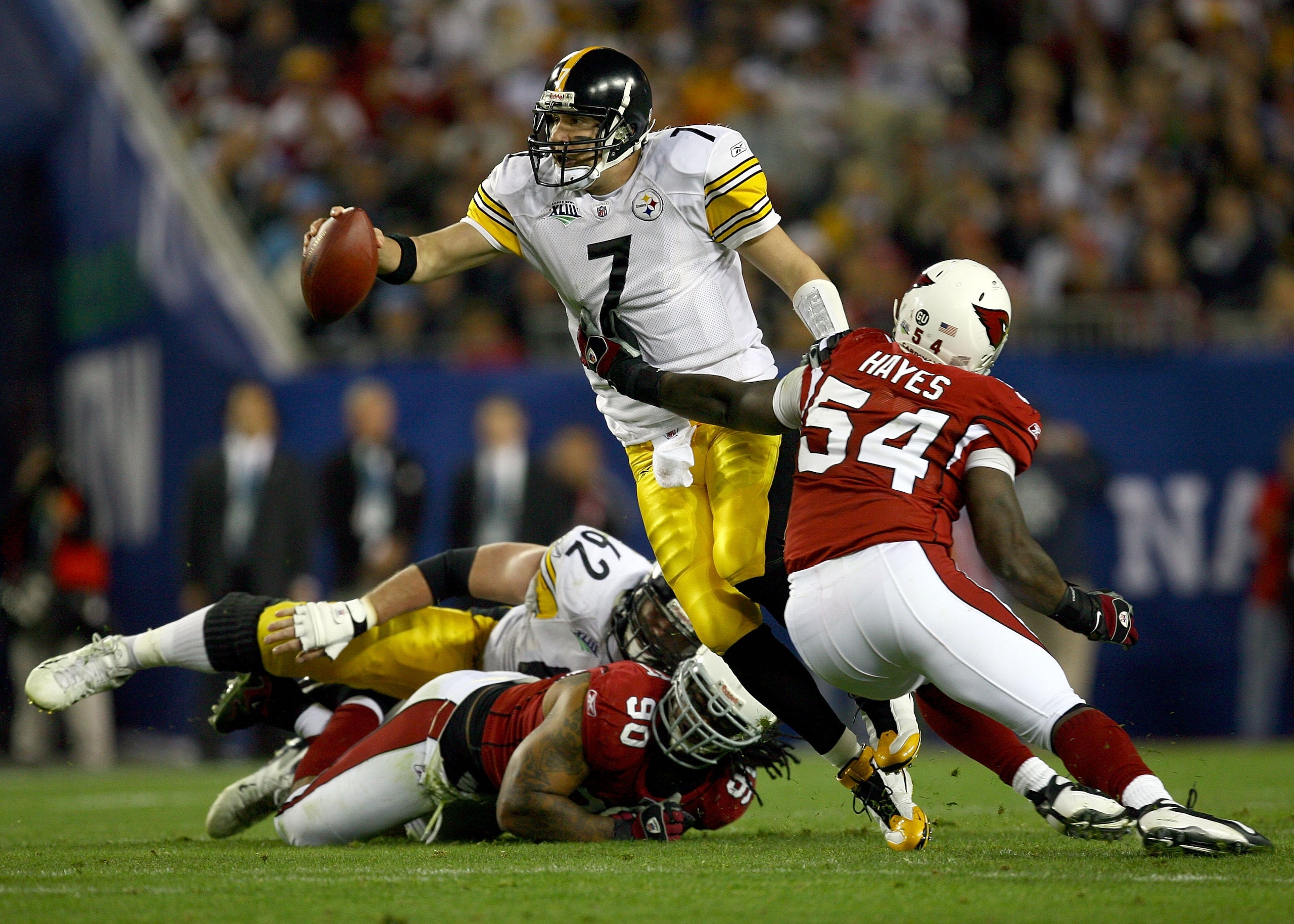 TAMPA, FL - FEBRUARY 01: Quarterback Ben Roethlisberger #7 of the Pittsburgh Steelers attempts to escape the grasp of Gerald Hayes #54 of the Arizona Cardinals during Super Bowl XLIII on February 1, 2009 at Raymond James Stadium in Tampa, Florida. (Phot TAMPA, FL - FEBRUARY 01: Quarterback Ben Roethlisberger #7 of the Pittsburgh Steelers attempts to escape the grasp of Gerald Hayes #54 of the Arizona Cardinals during Super Bowl XLIII on February 1, 2009 at Raymond James Stadium in Tampa, Florida. (Phot