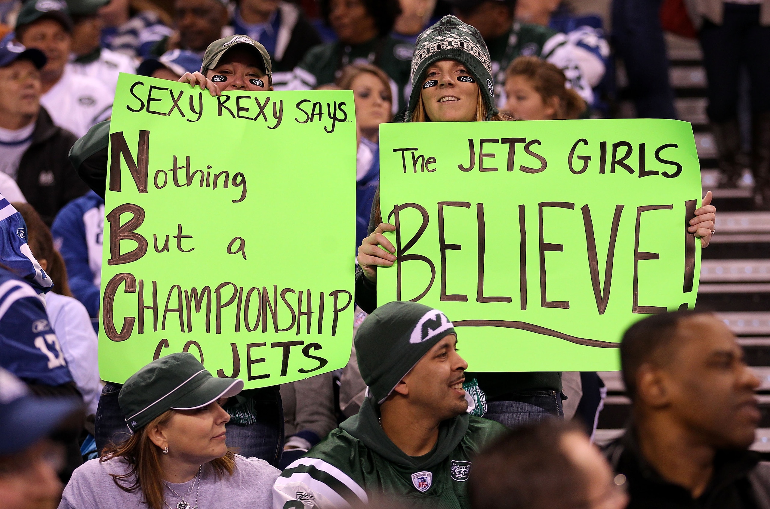 INDIANAPOLIS, IN - JANUARY 08:  Fans of the New York Jets hold up signs in support of their team and head coach Rex Ryan against the Indianapolis Colts during their 2011 AFC wild card playoff game at Lucas Oil Stadium on January 8, 2011 in Indianapolis, I