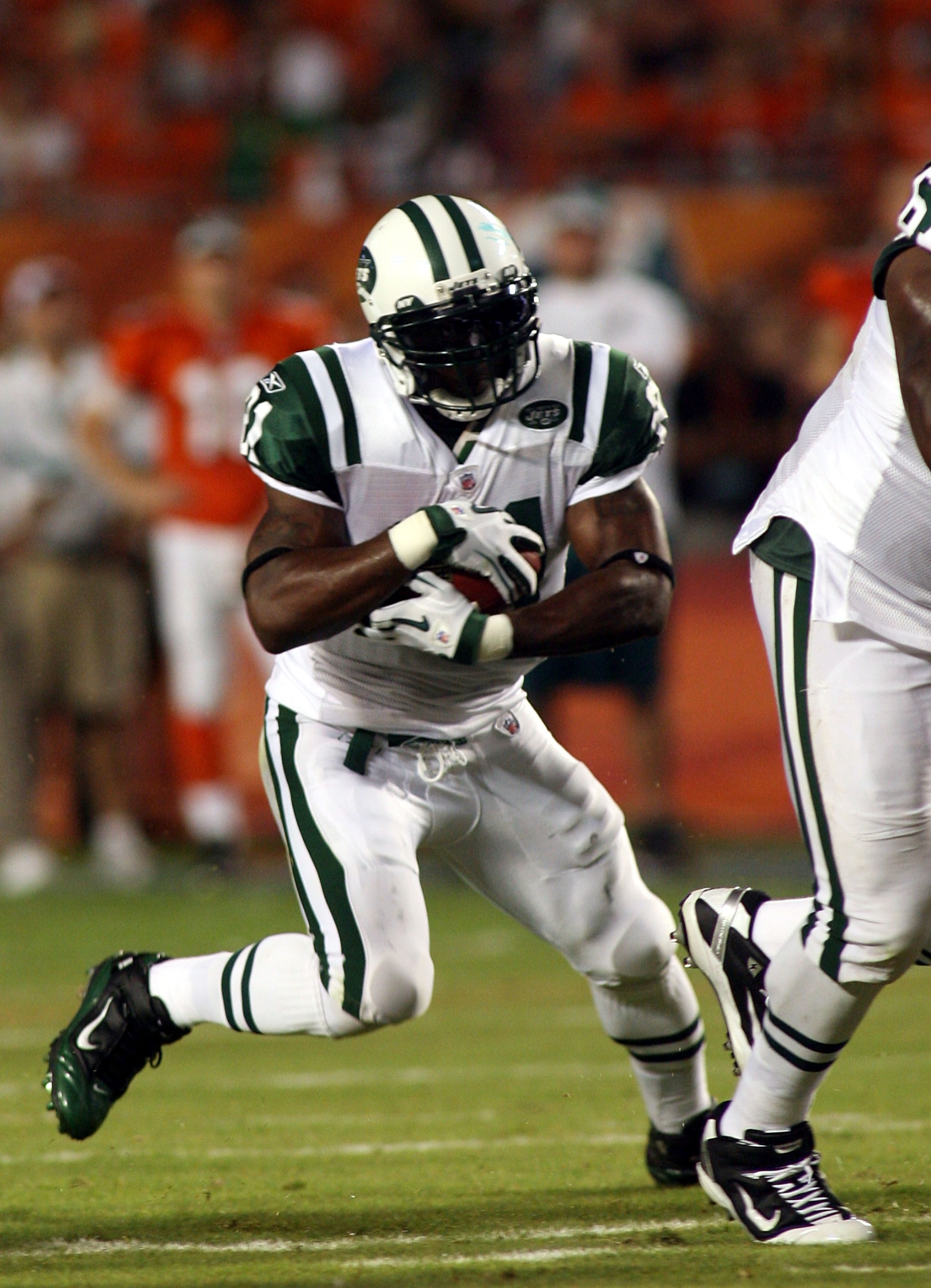 MIAMI - SEPTEMBER 26:  Running back LaDanian Tomlinson #21 of the New York Jets runs against the Miami Dolphins at Sun Life Stadium on September 26, 2010 in Miami, Florida.  (Photo by Marc Serota/Getty Images)