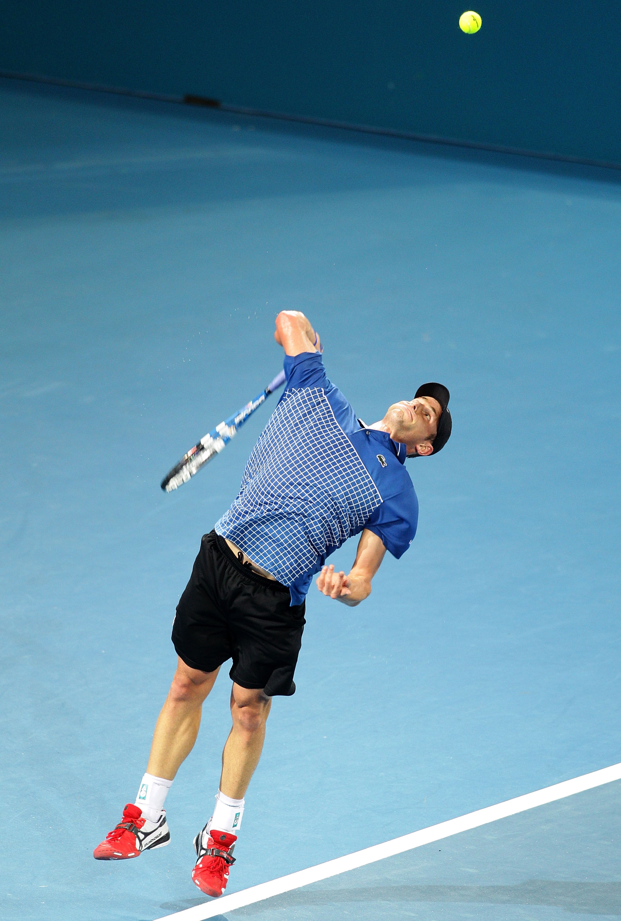 BRISBANE, AUSTRALIA - JANUARY 03: Andy Roddick of the USA serves during his first round match against Marinko Matosevic of Australia during day two of the Brisbane International at Queensland Tennis Centre on January 3, 2011 in Brisbane, Australia.  (Phot