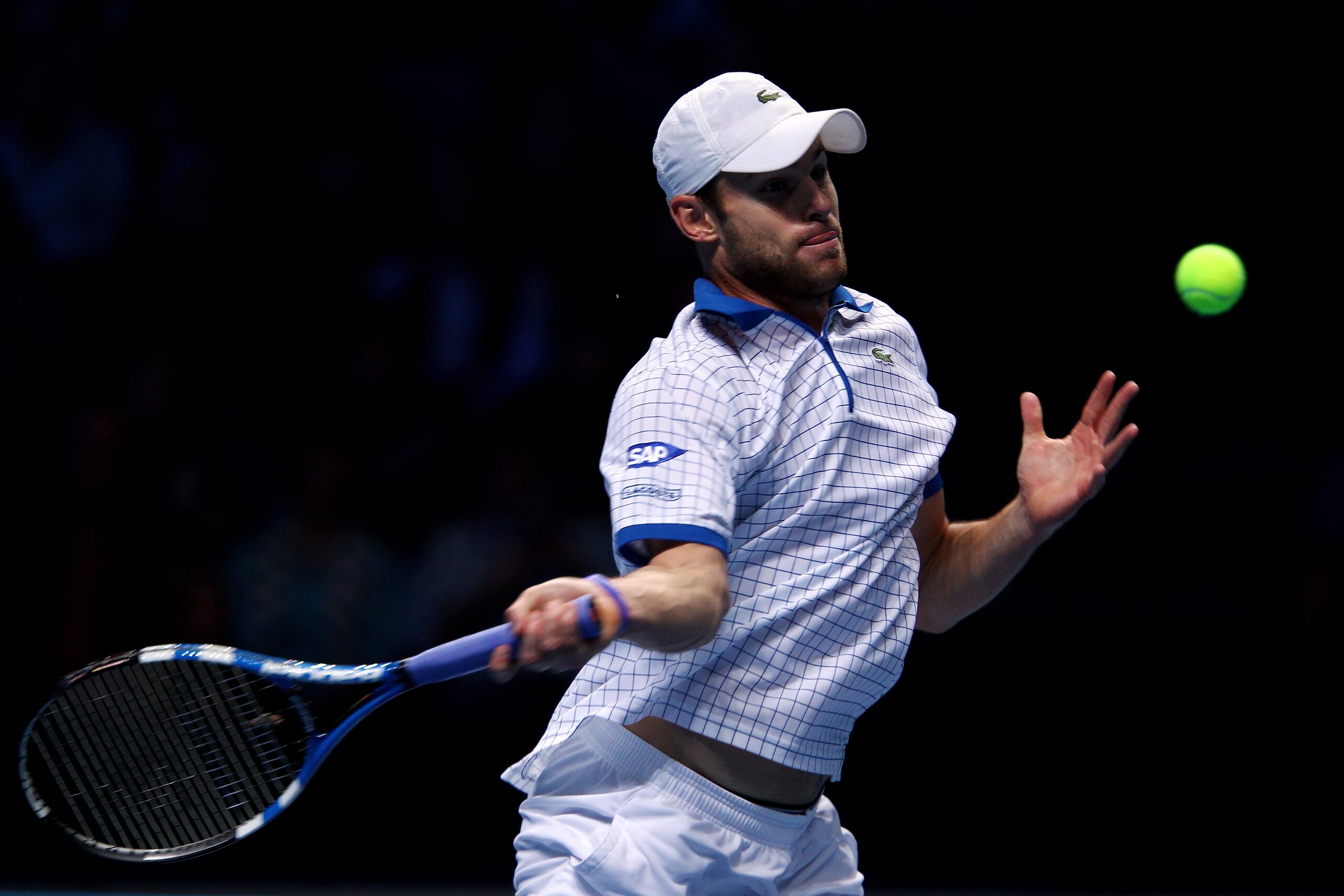 LONDON, ENGLAND - NOVEMBER 24:  Andy Roddick of the USA returns a shot during his men's singles match against Tomas Berdych of Czech Republic during ATP World Tour Finals at O2 Arena on November 24, 2010 in London, England.  (Photo by Clive Brunskill/Gett
