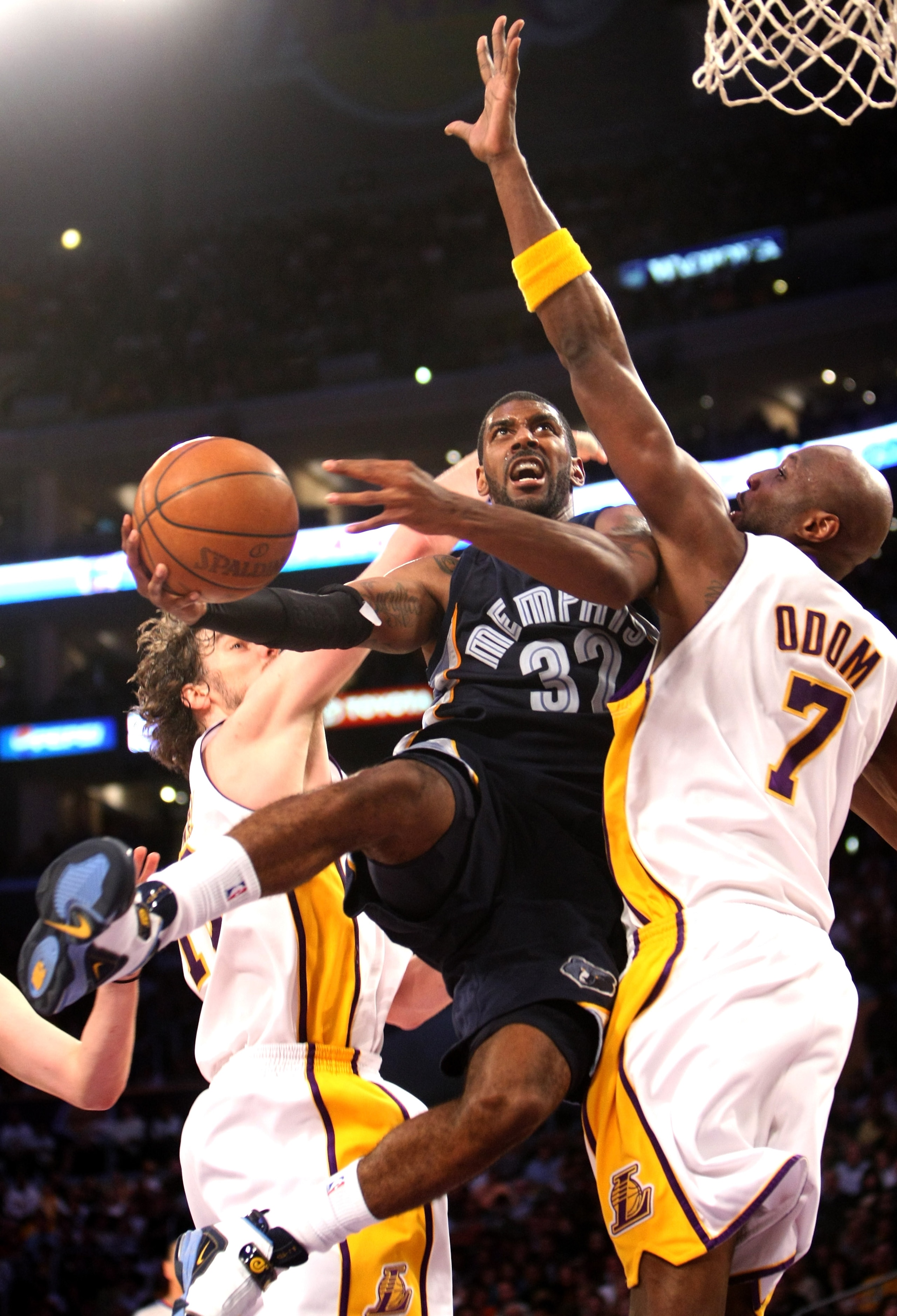 LOS ANGELES - APRIL 12: O.J. Mayo #32 of the Memphis Grizzlies goes up for a shot against Lamar Odom #7 of the Los Angeles Lakers on April 12, 2009 at Staples Center in Los Angeles, California. The Lakers won 92-75. NOTE TO USER: User expressly acknowledg